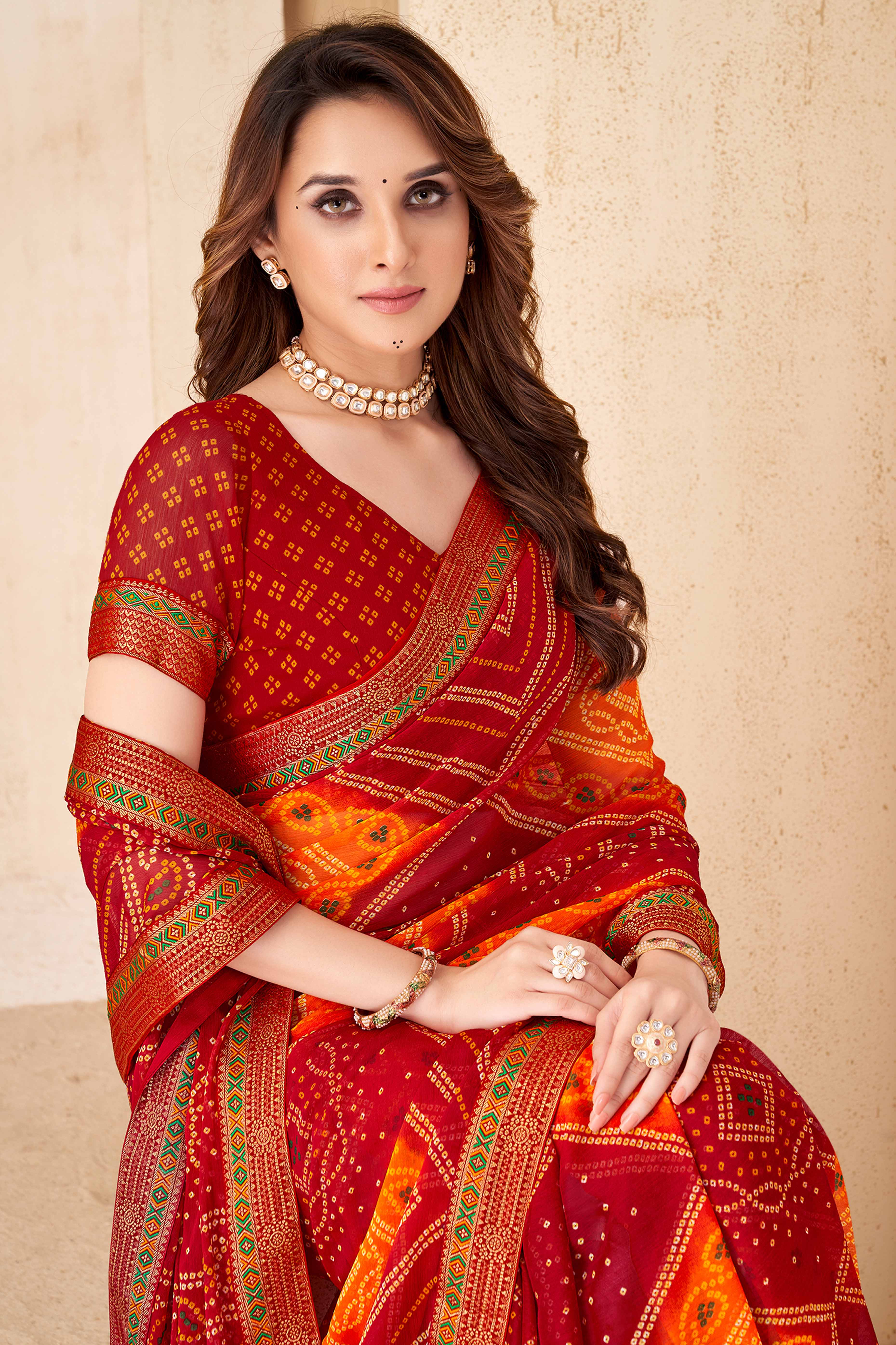 Maroon & Orange Bandhani Printed Chiffon Saree Enhanced with Delicate Lace Border Work