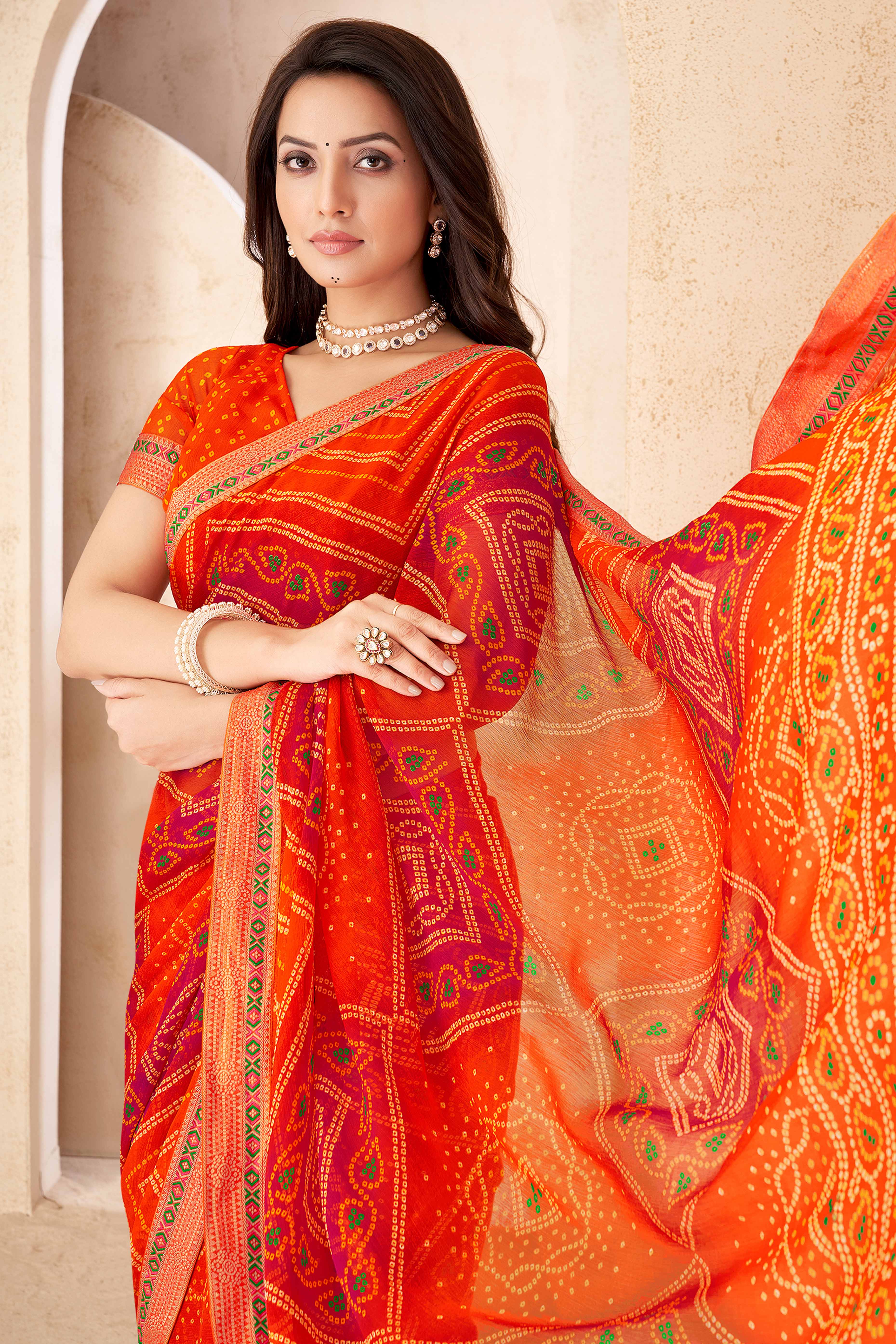 Orange Bandhani Printed Chiffon Saree Enhanced with Delicate Lace Border Work