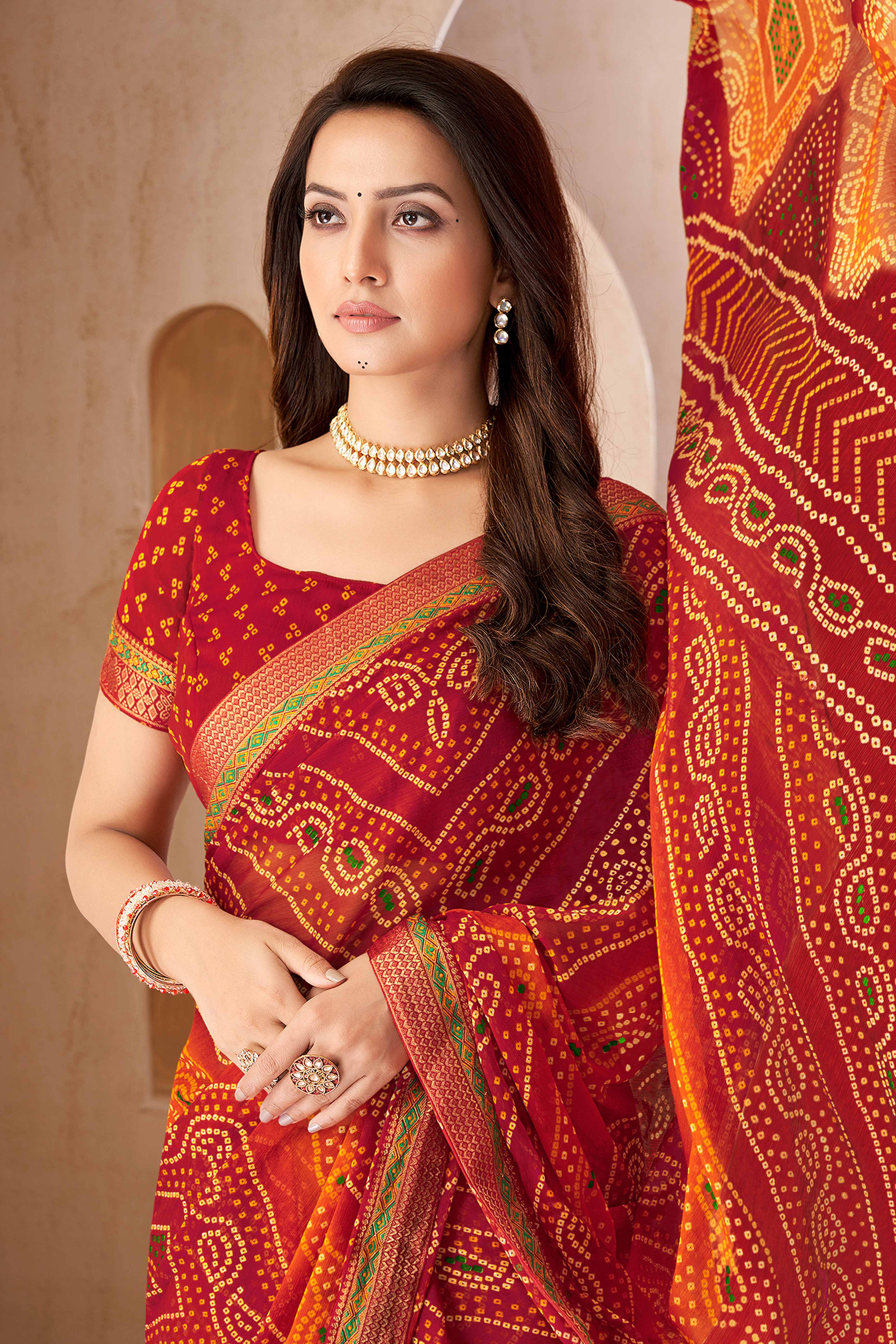 Maroon & Orange Bandhani Printed Chiffon Saree Enhanced with Delicate Lace Border Work