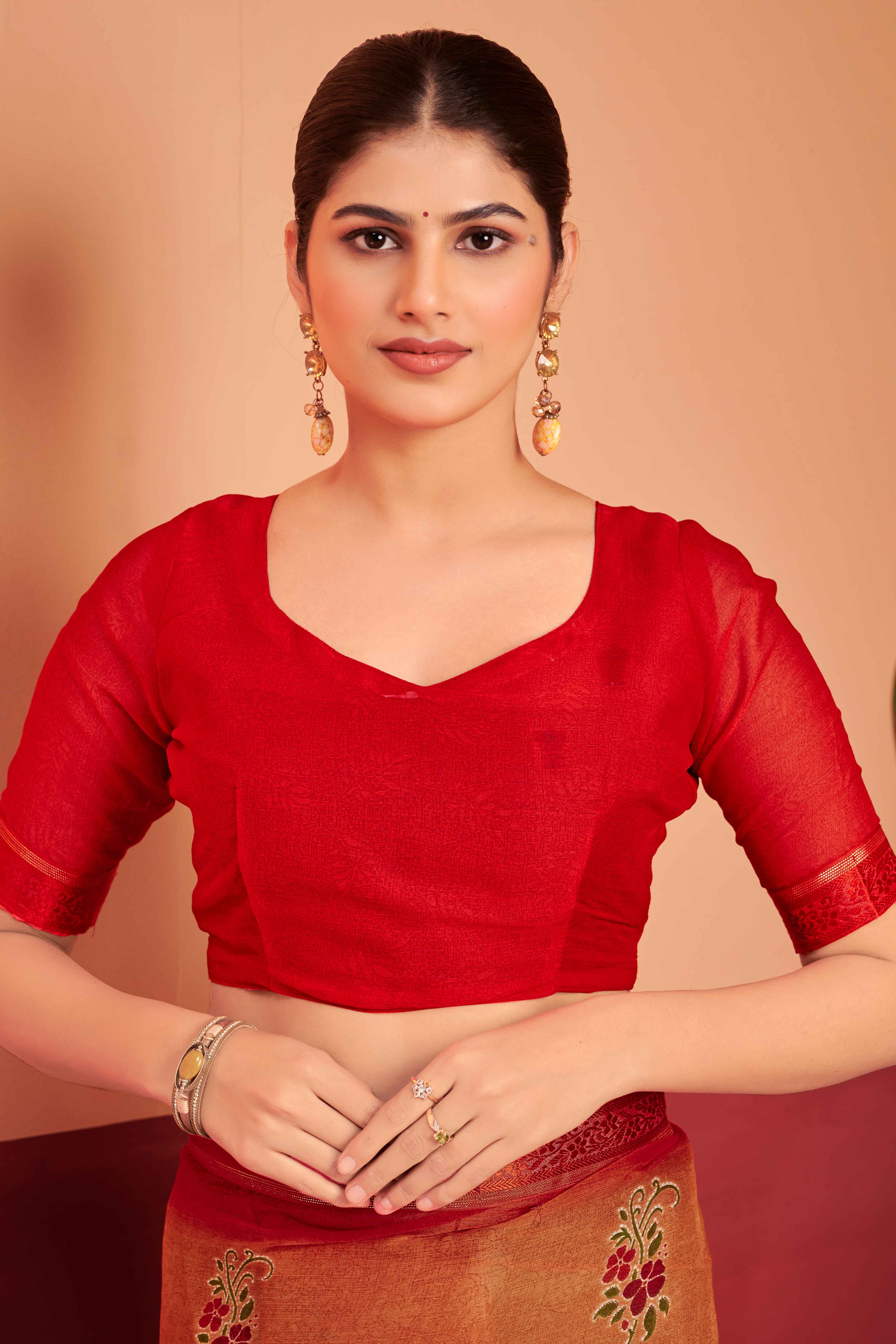 Orange Chiffon Saree Featuring Delicate Floral Prints & A Graceful Lace Border