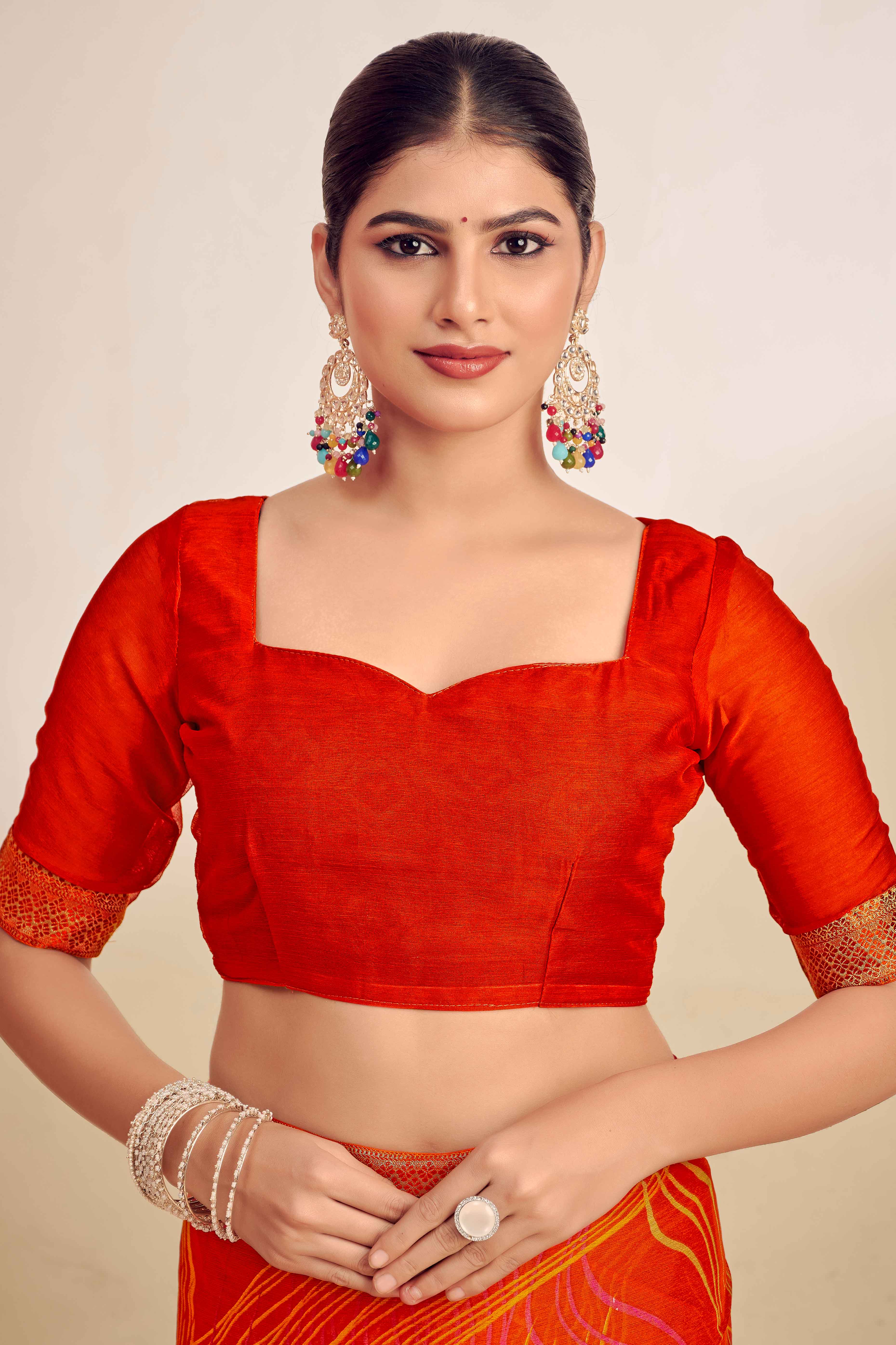 Orange Chiffon Saree Adorned With Artistic Print & Finely Crafted Woven Lace Border