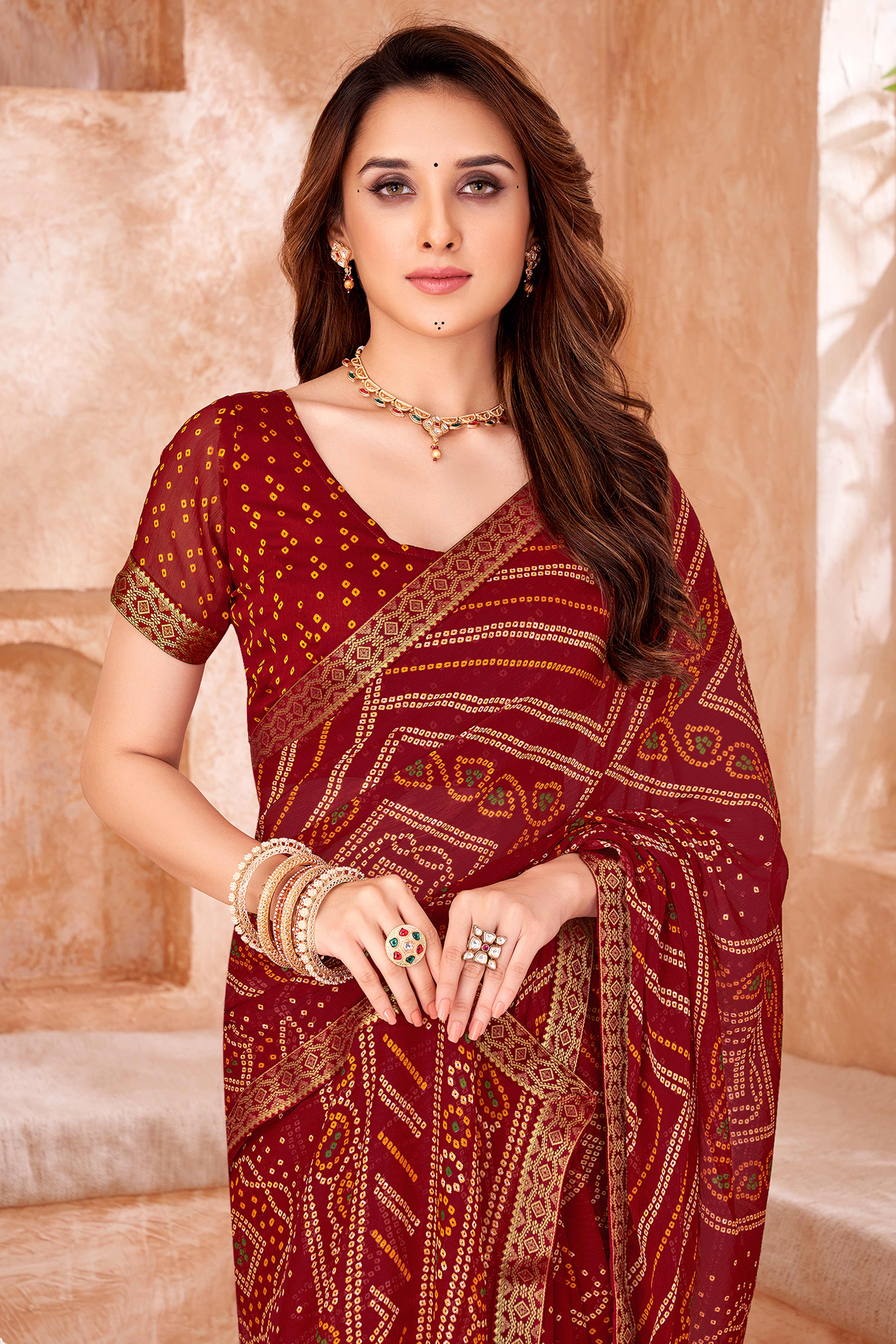 Maroon Chiffon Saree Featuring Traditional Bandhani Prints & A Graceful Lace Edge