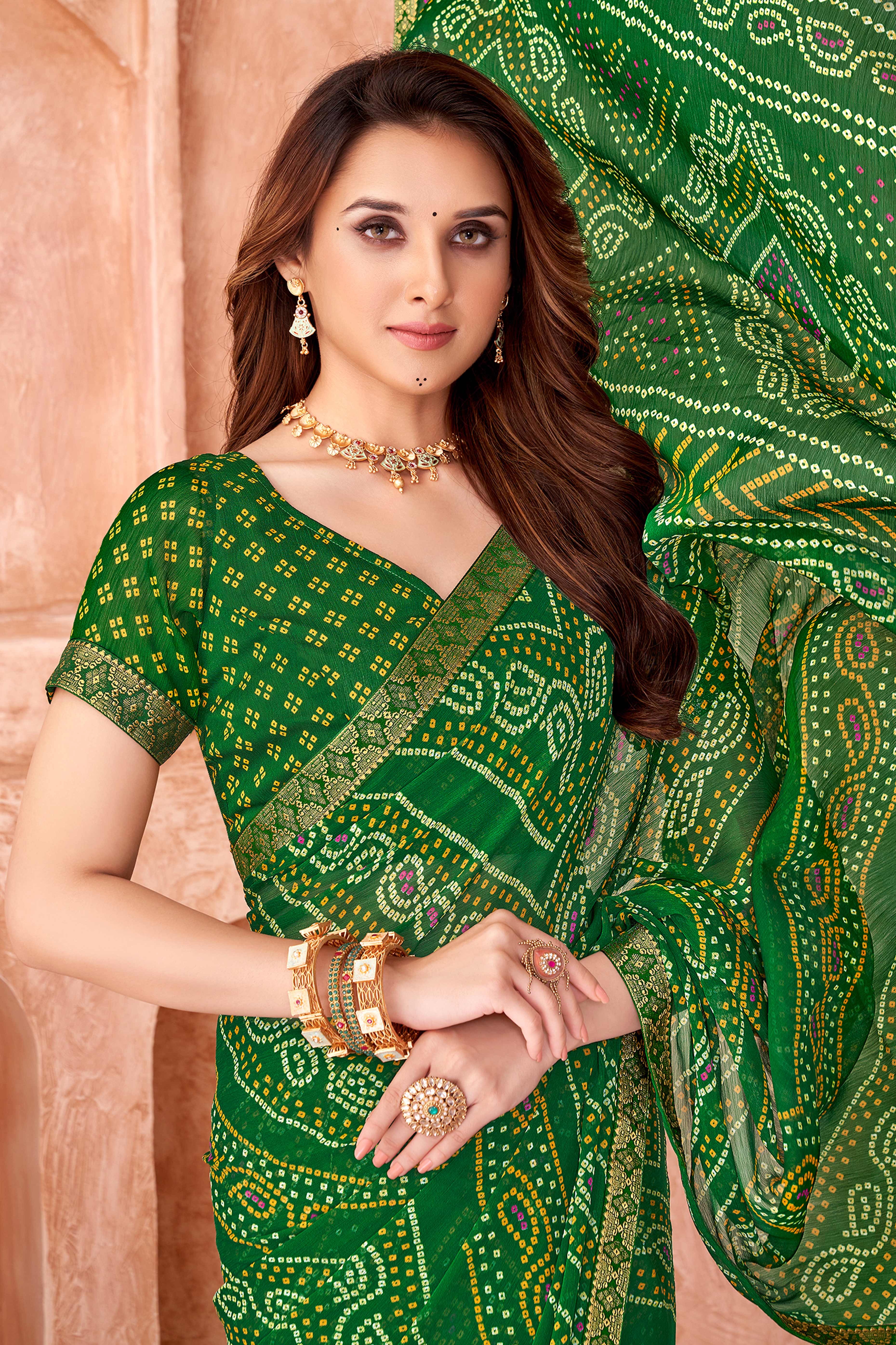Green Chiffon Saree Featuring Traditional Bandhani Prints & A Graceful Lace Edge