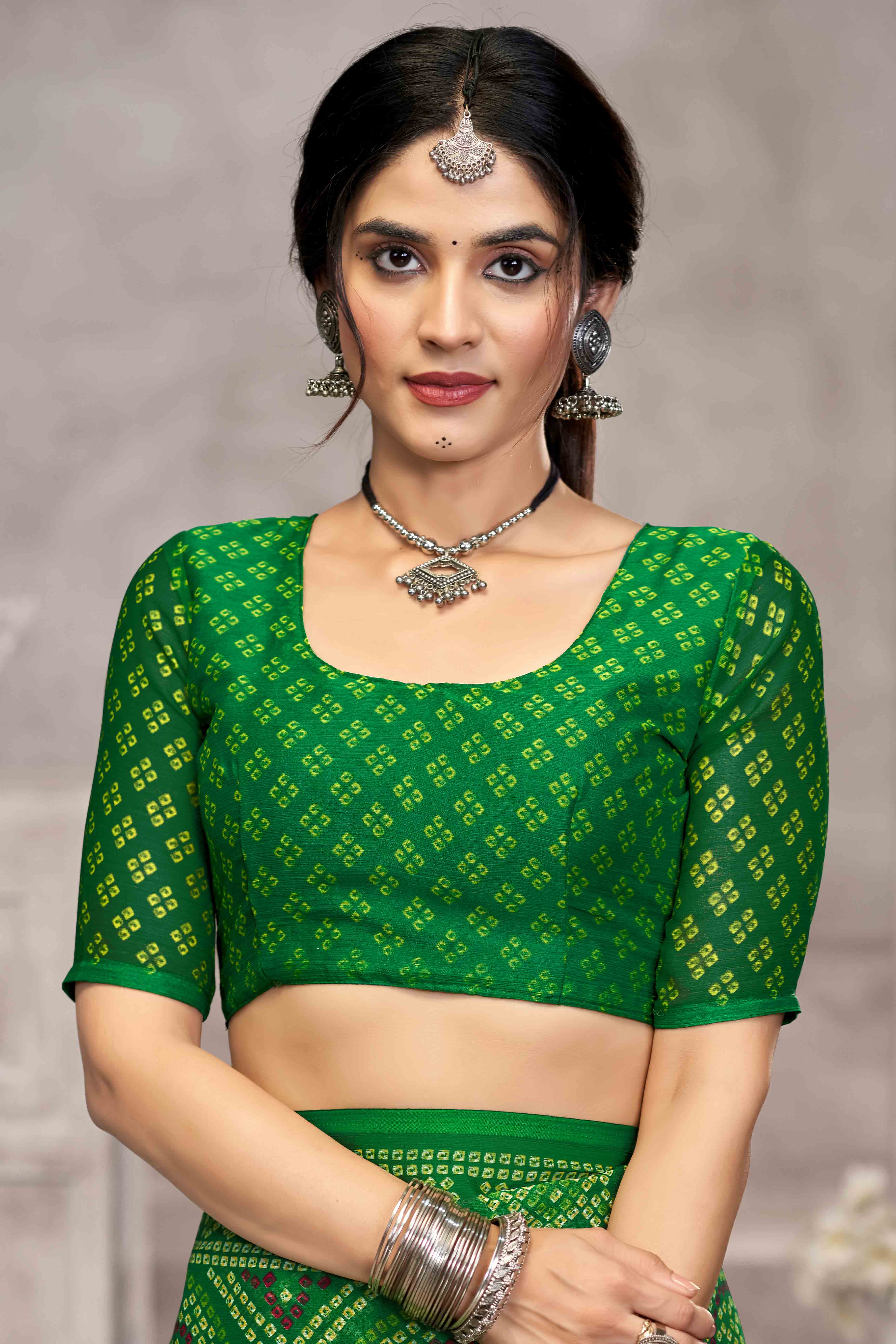 Green Chiffon Saree Features Bandhani Print for Casual Occasion