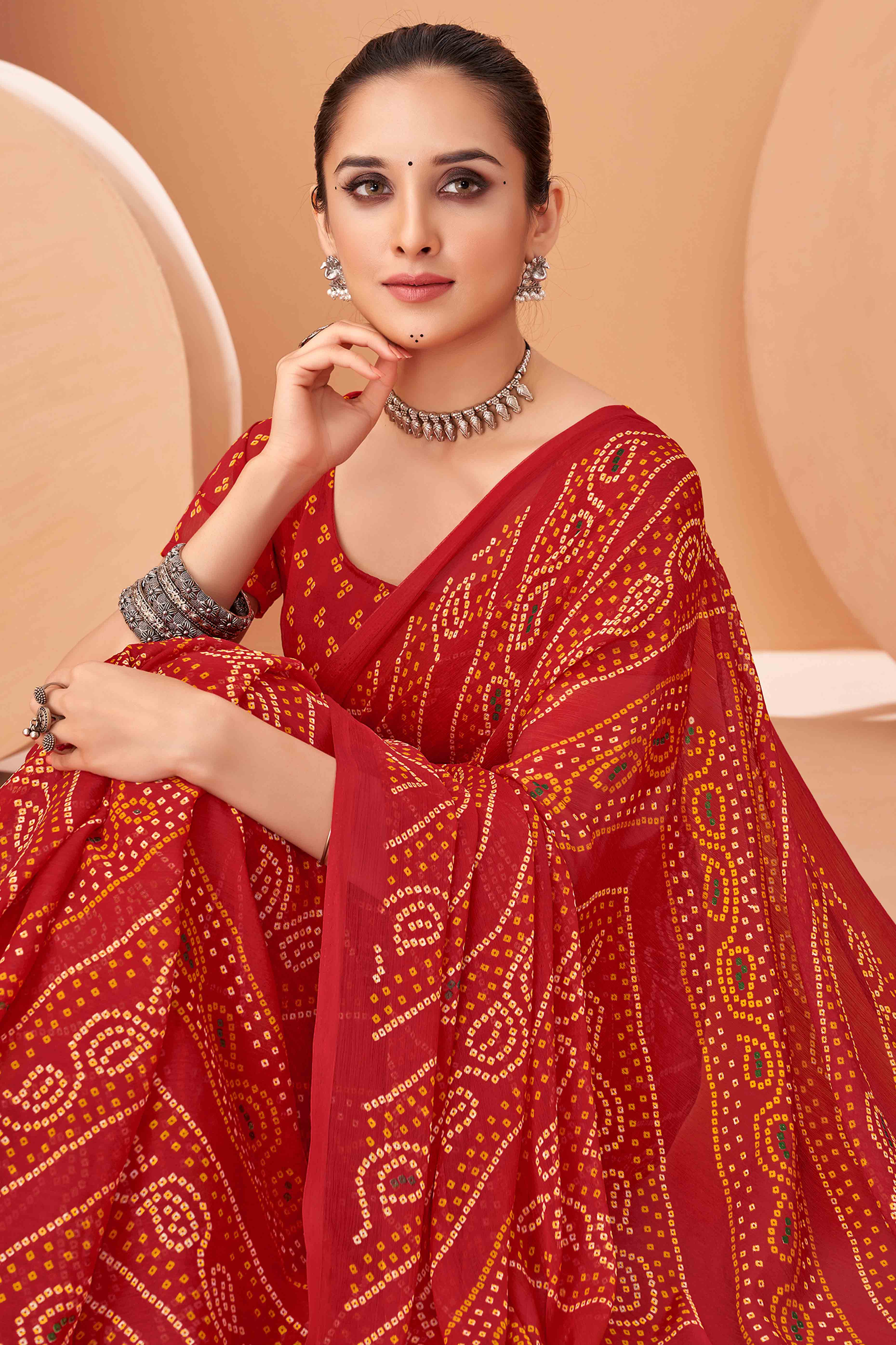 Red Bandhani Printed Chiffon Saree Accented With Intricate Lace Border Work