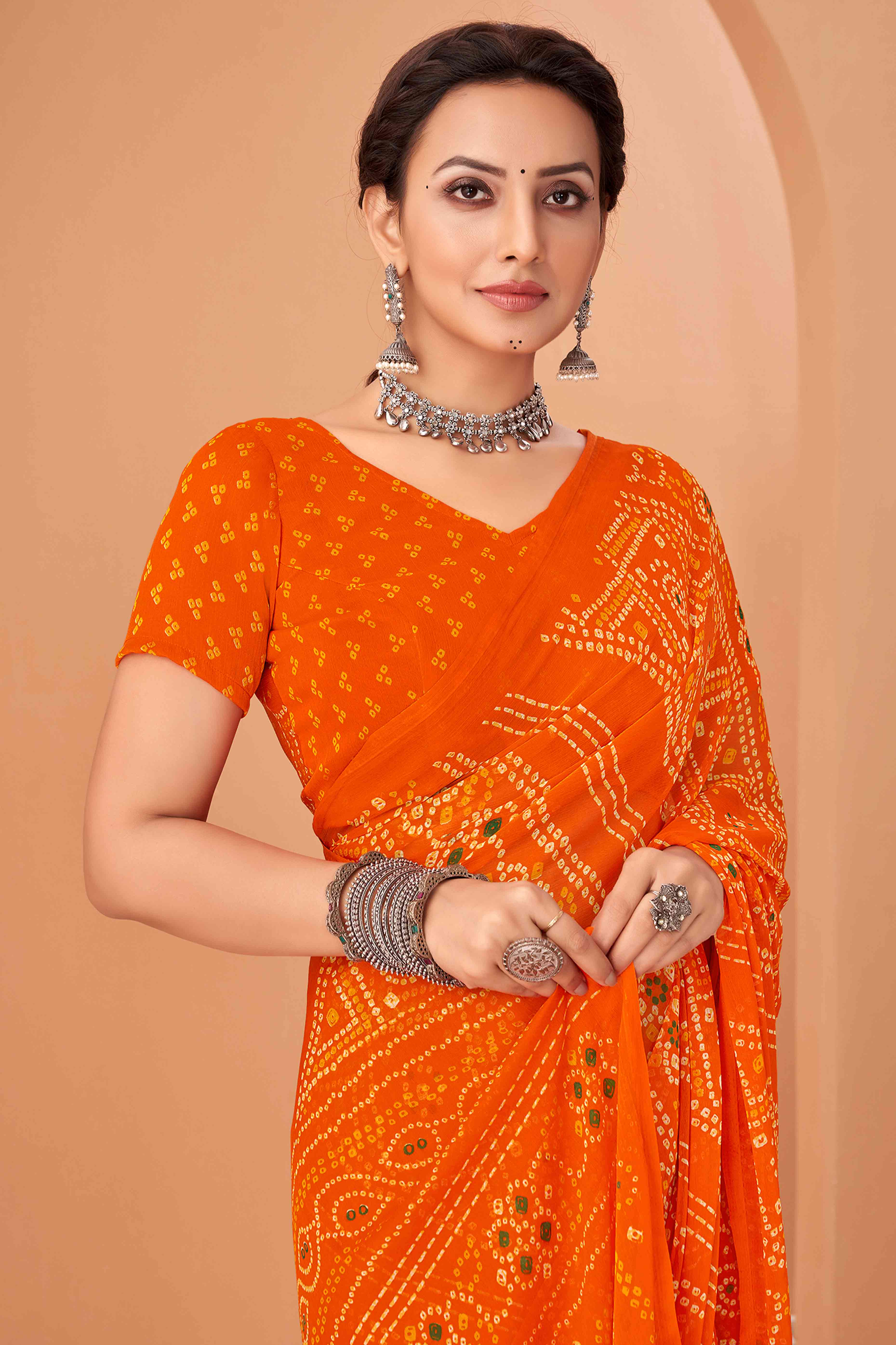 Orange Bandhani Printed Chiffon Saree Accented With Intricate Lace Border Work