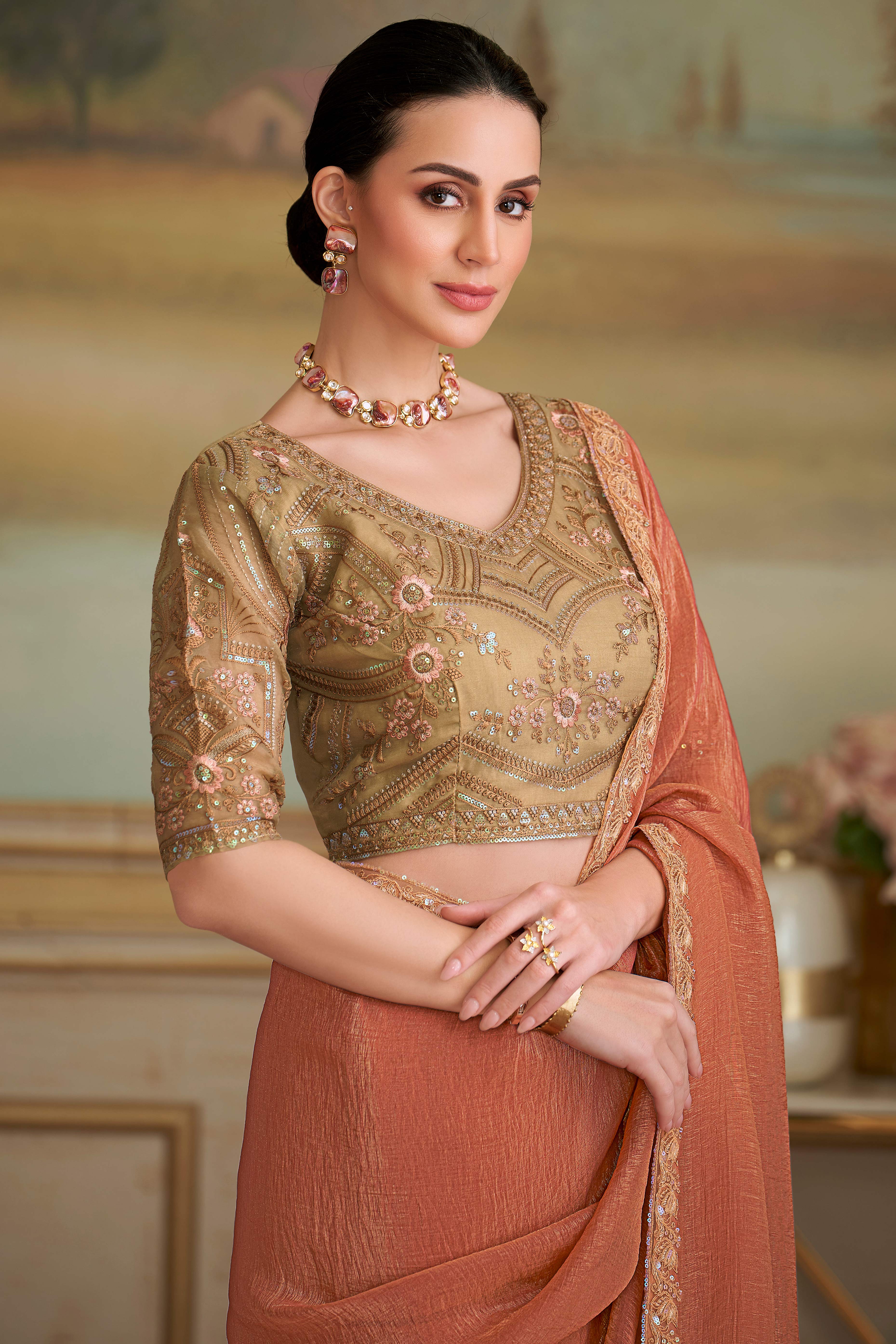 Sophisticated Rust Orange Gold Georgette Saree Accented With Floral Sequins Embroidered Lace Border