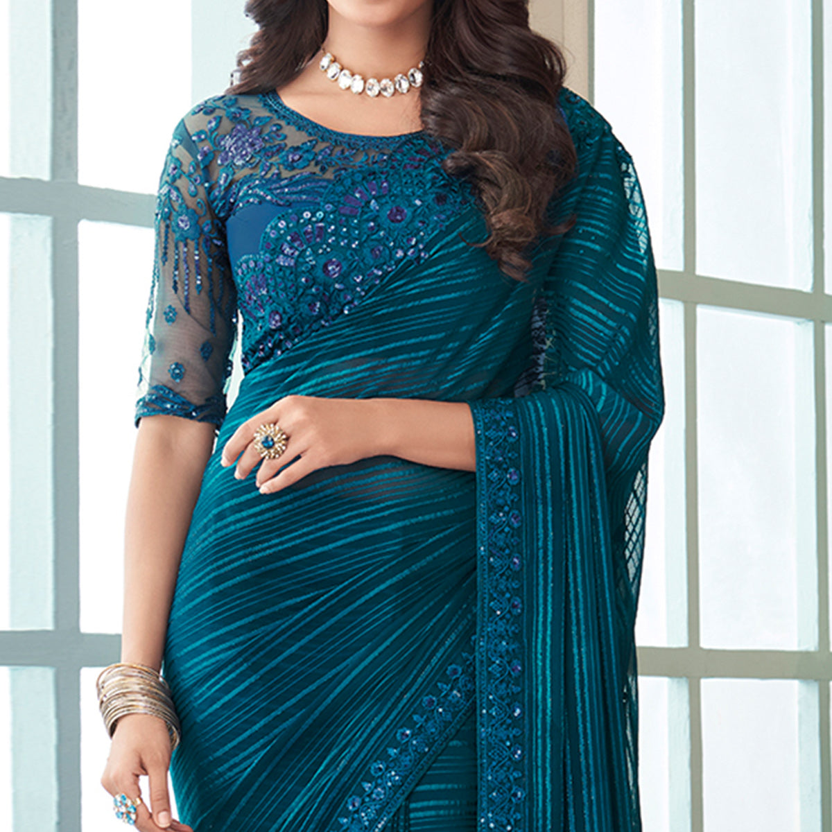 Teal Sequins Embroidered Satin Saree