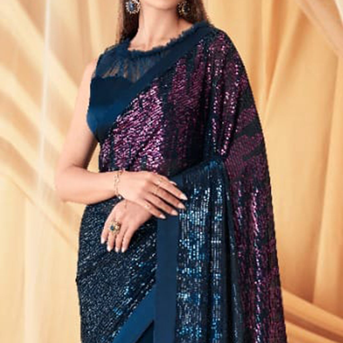 Blue Sequins Embroidered Georgette Saree With Tassels