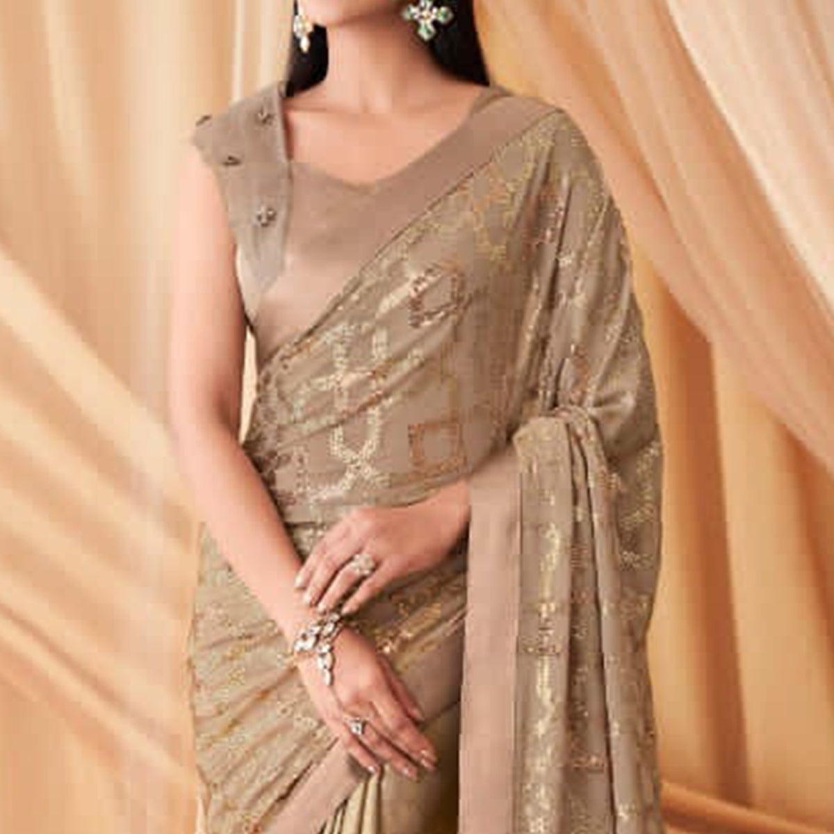 Beige Sequins Embroidered Georgette Saree With Tassels