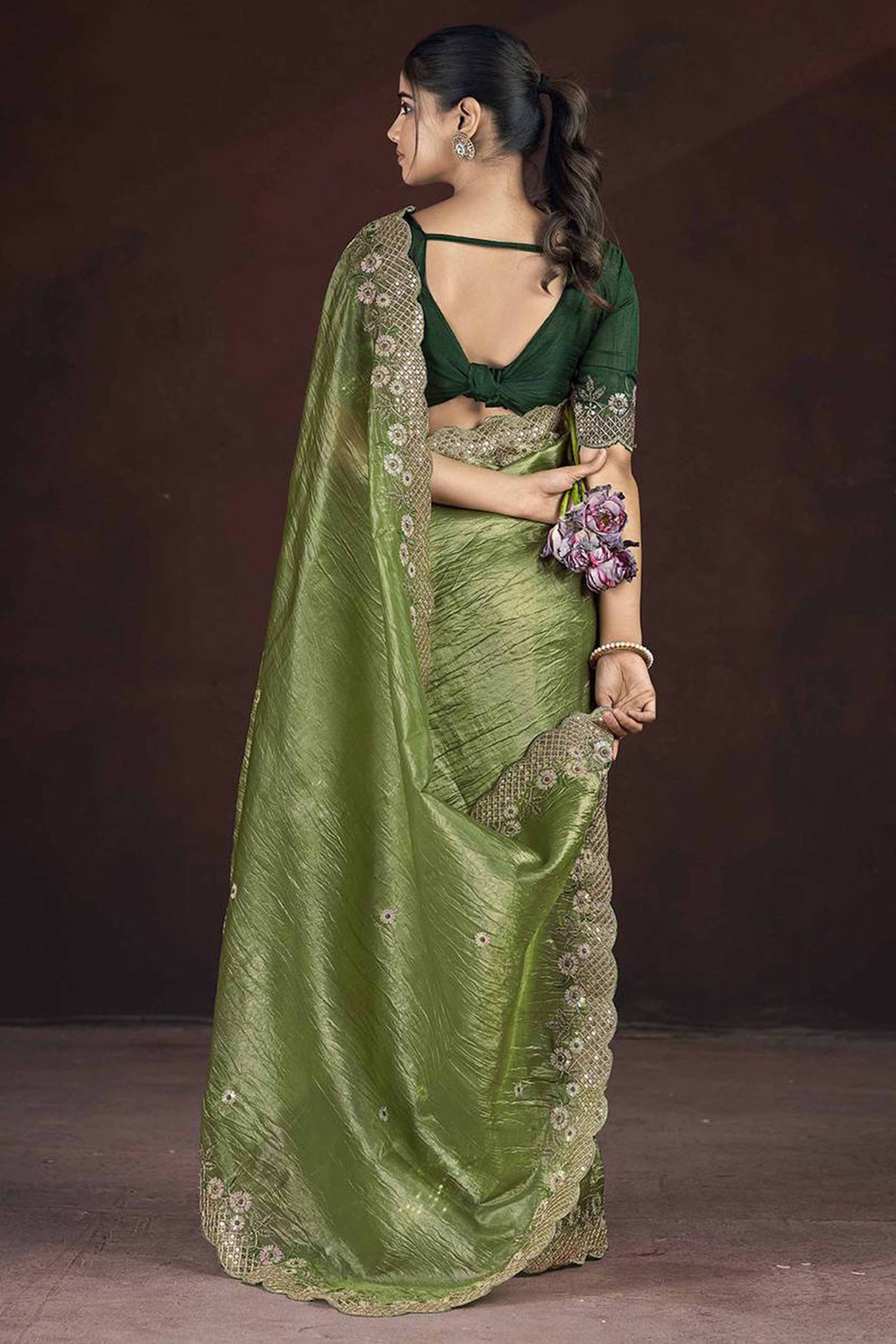 Green Organza Saree with Embroidery on the Edges for a Graceful Contemporary Look