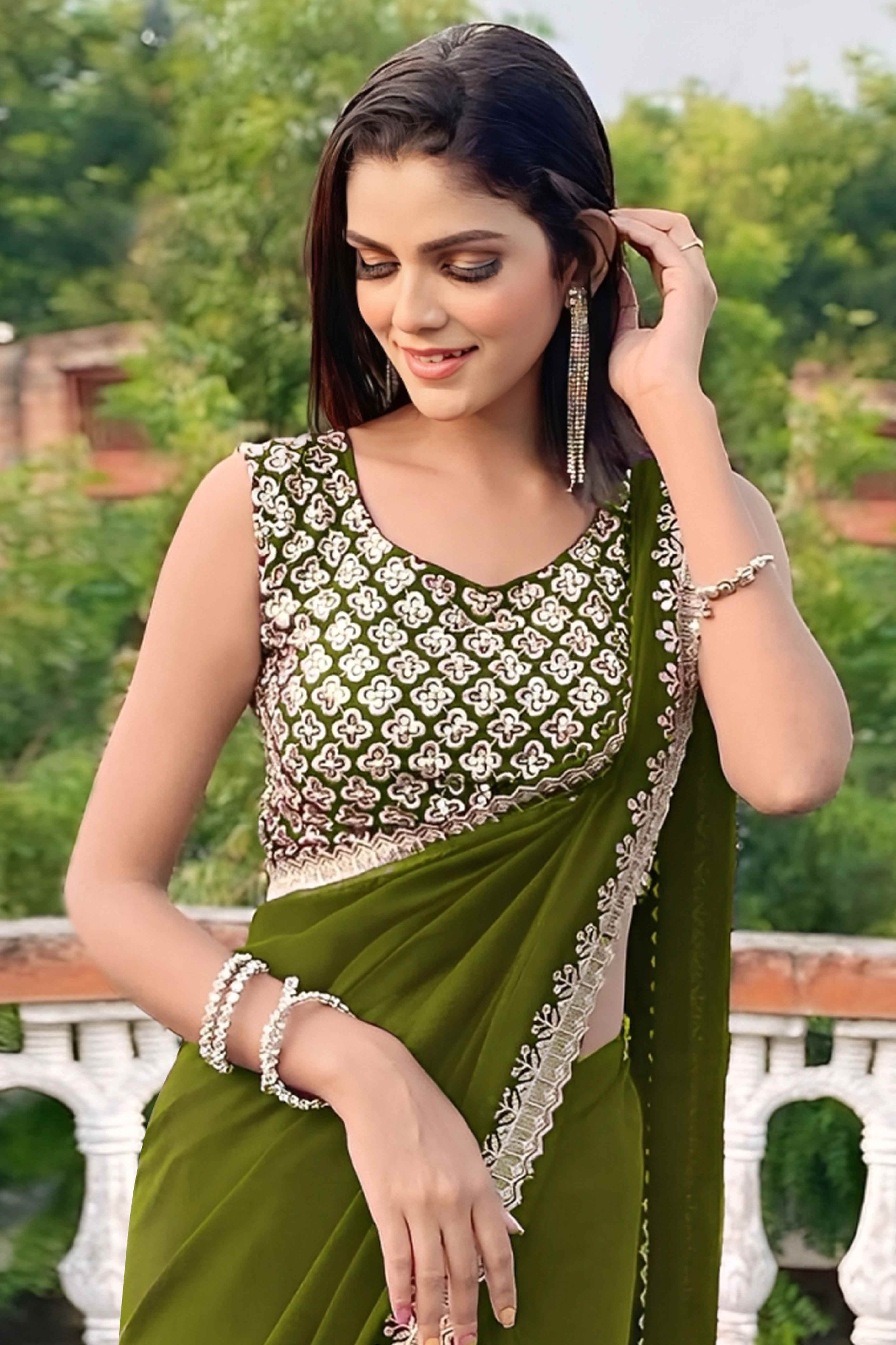 Green Georgette Saree With Sleek Solid Finish And Embroidered Edging