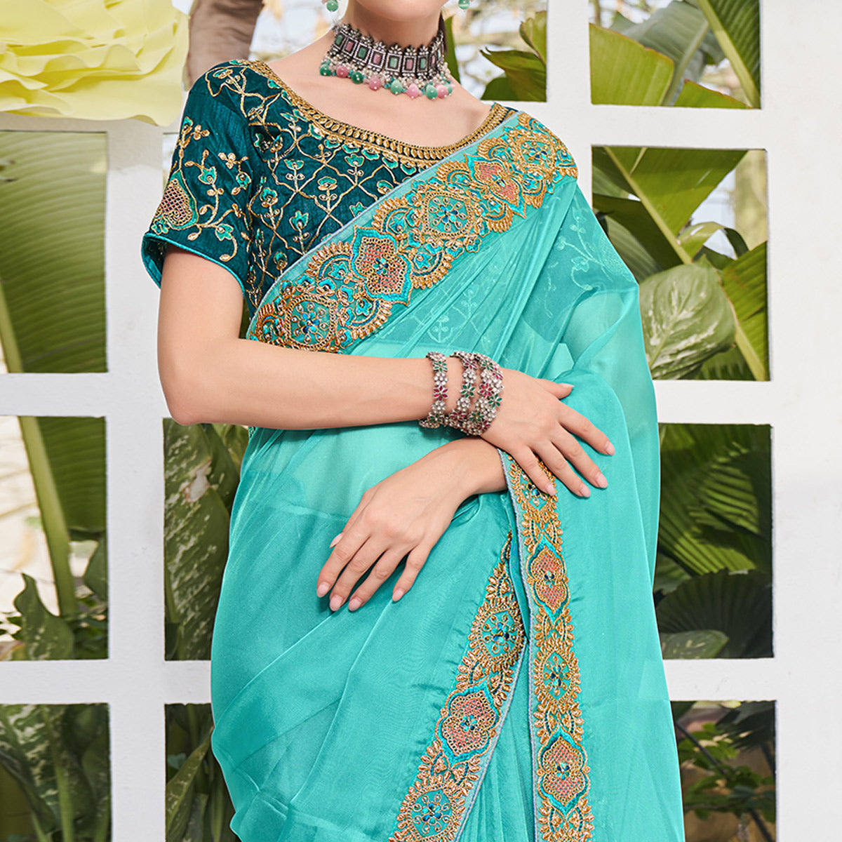 Aqua Blue Solid With Embroidered Border Organza Saree