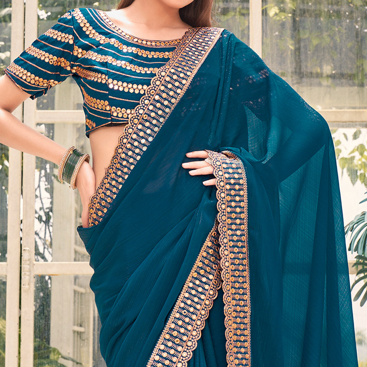 Teal Solid With Embroidered Border Georgette Saree