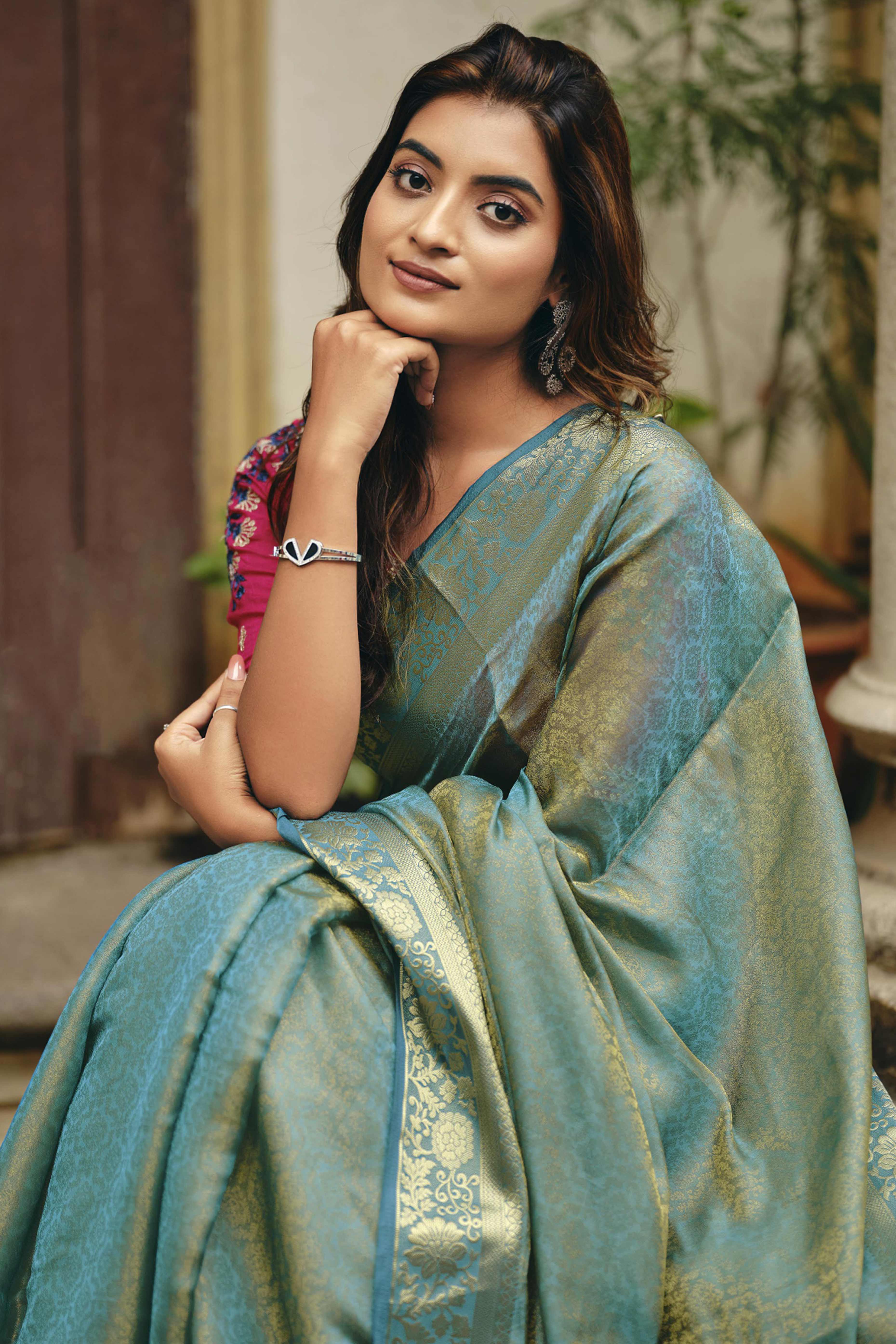 Elegant Rama Blue Partywear Nylon Silk Saree with Stone & Weaving Details