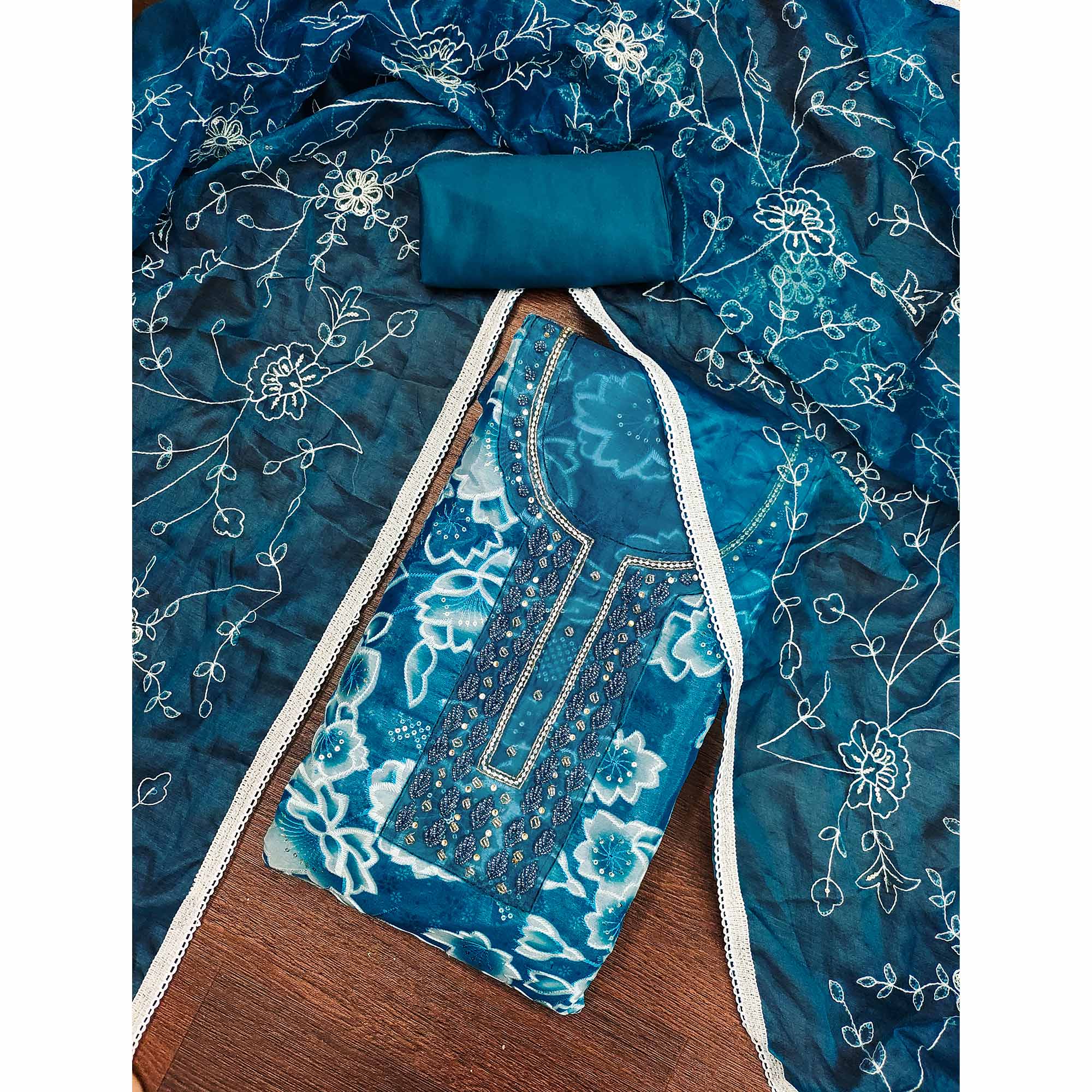 Blue Delicate Floral Sequins & Hand Embellishments On Flowing Organza Dress Material