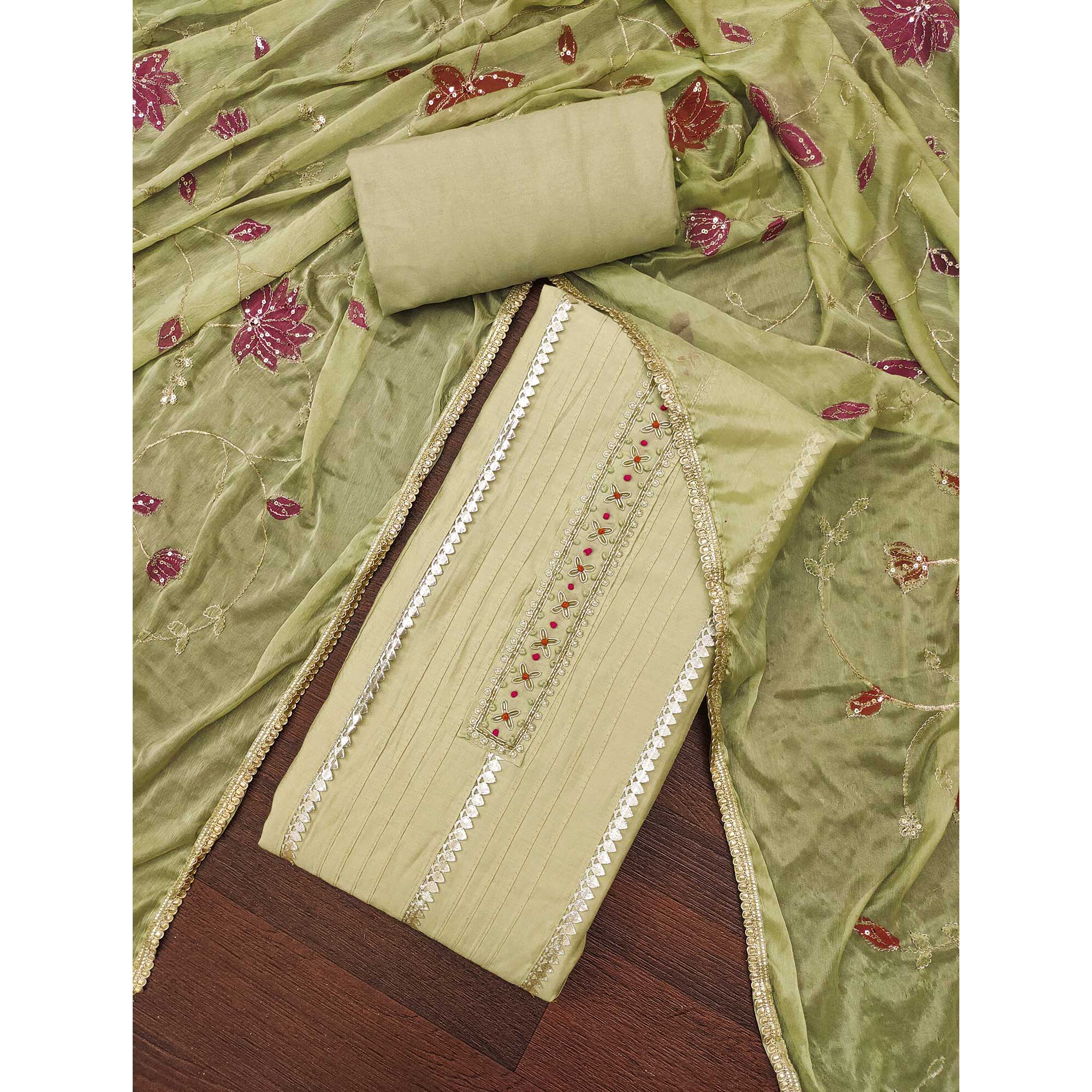 Green Cotton Silk Dress Material Embellished With Elegant Moti Handwork & Delicate Gota Patti Lace