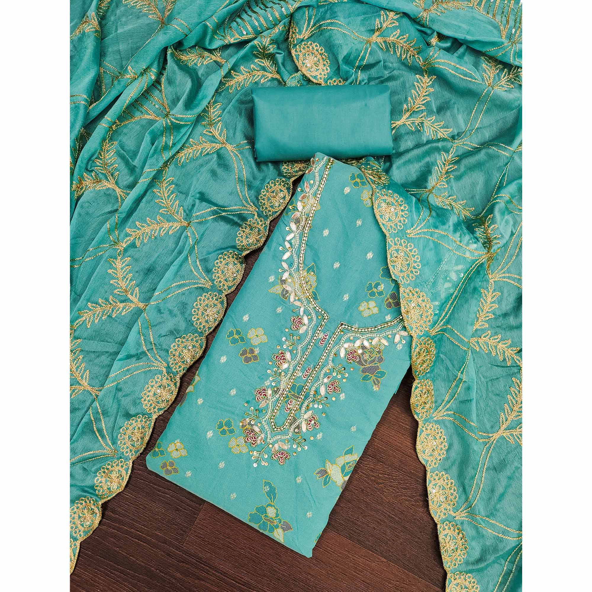 Rama Green Unstitched Dress Material in Shimmer Cotton Silk with Delicate Thread Work Embroidery