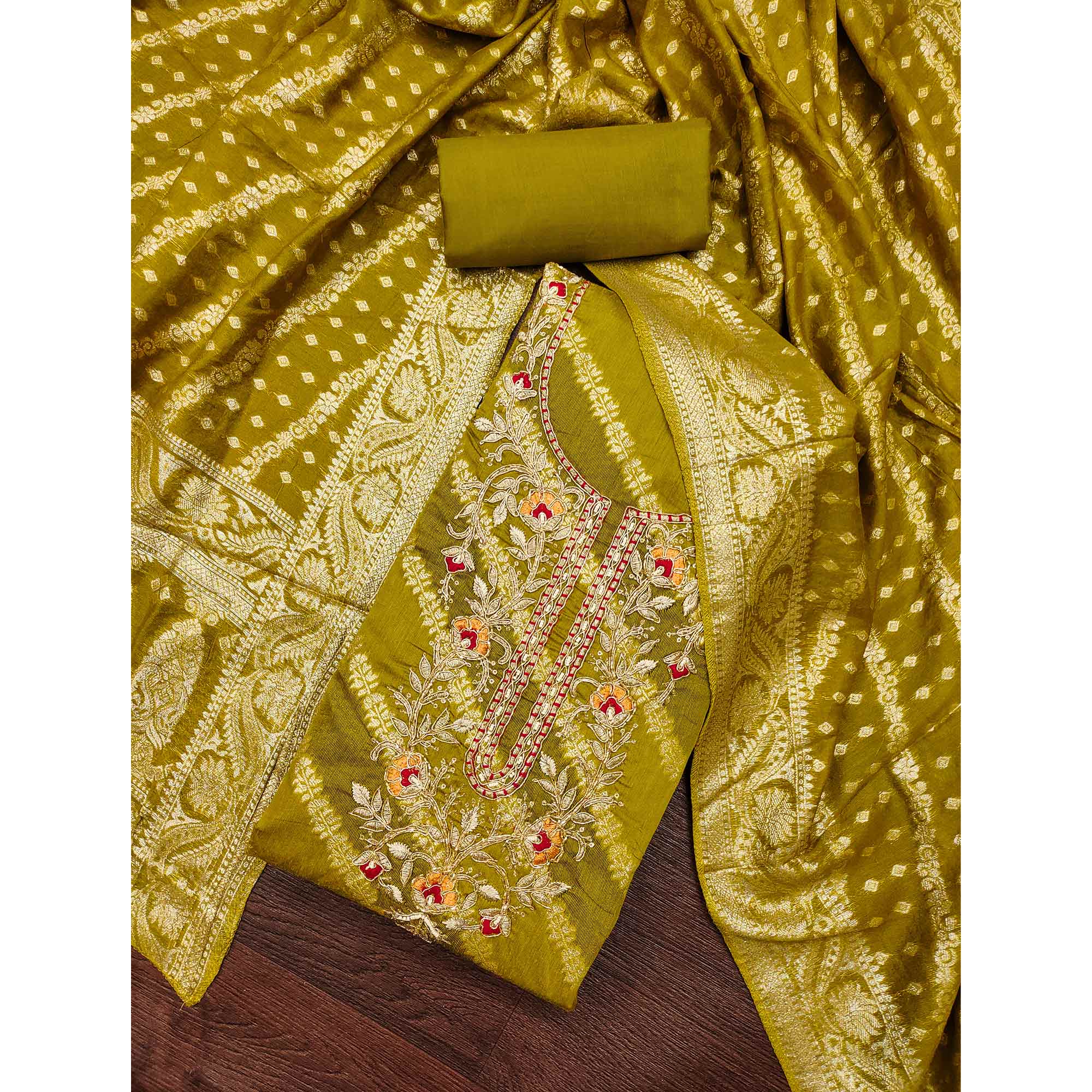 Green Shimmer Cotton Silk Suit Material Featuring Zari Weaving and Artistic Embroidered Detailing