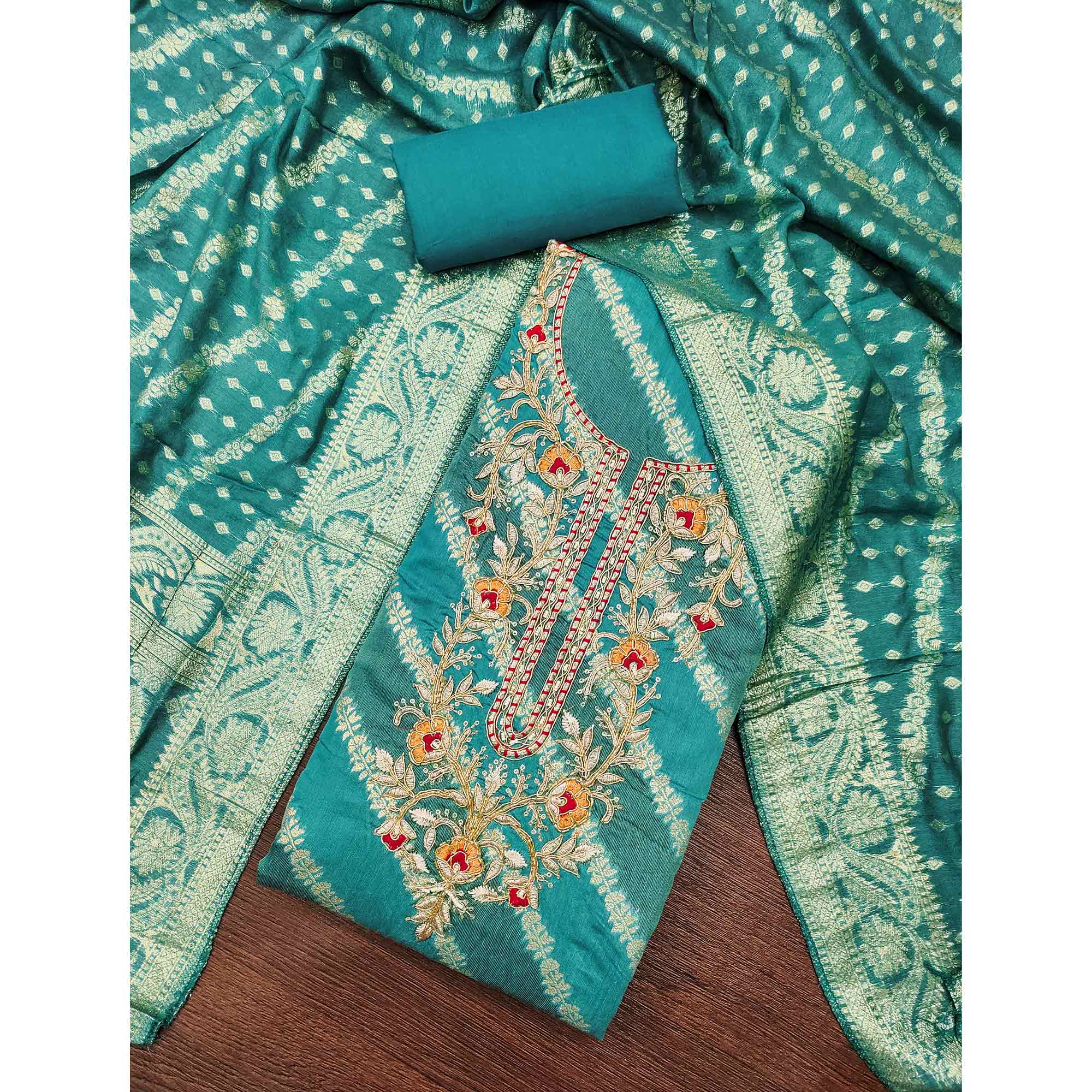 Rama Green Shimmer Cotton Silk Suit Material Featuring Zari Weaving and Artistic Embroidered Detailing