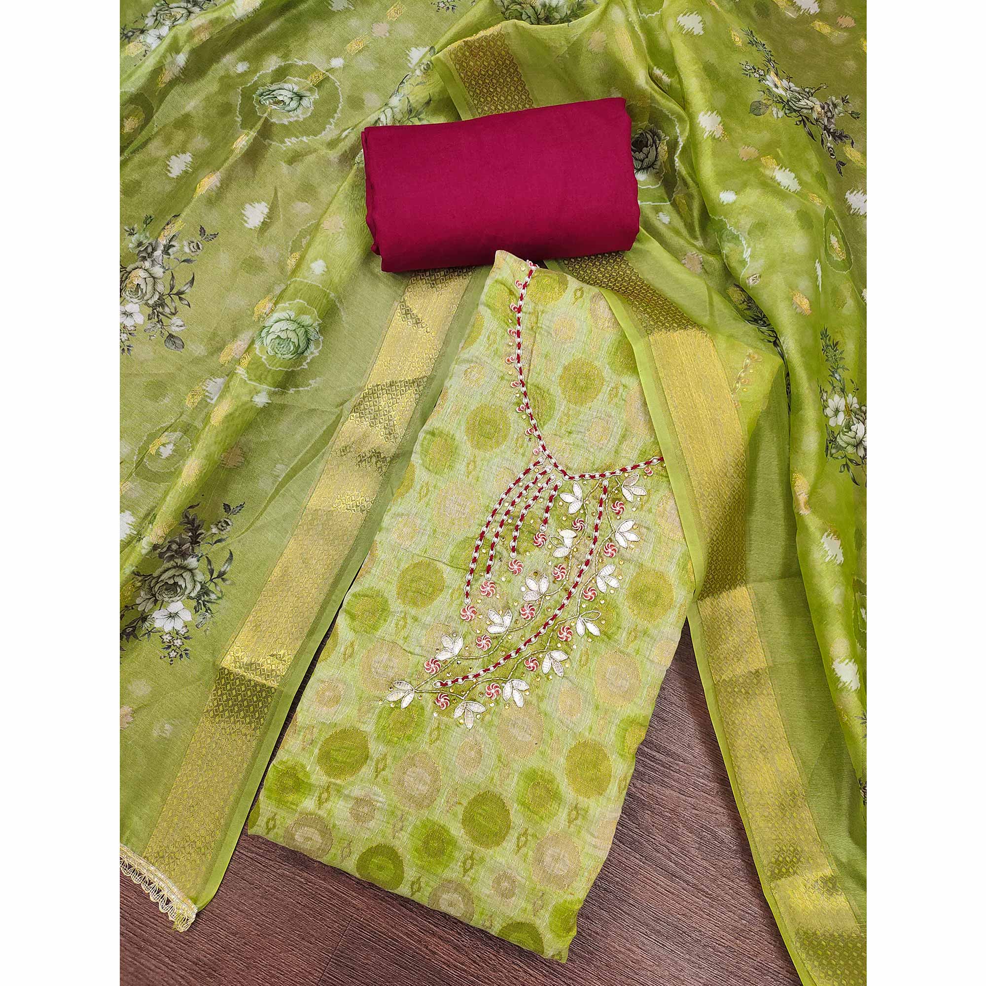 Sophisticated Green Zari Woven Jacquard Dress Material Highlighted With Floral Handwork