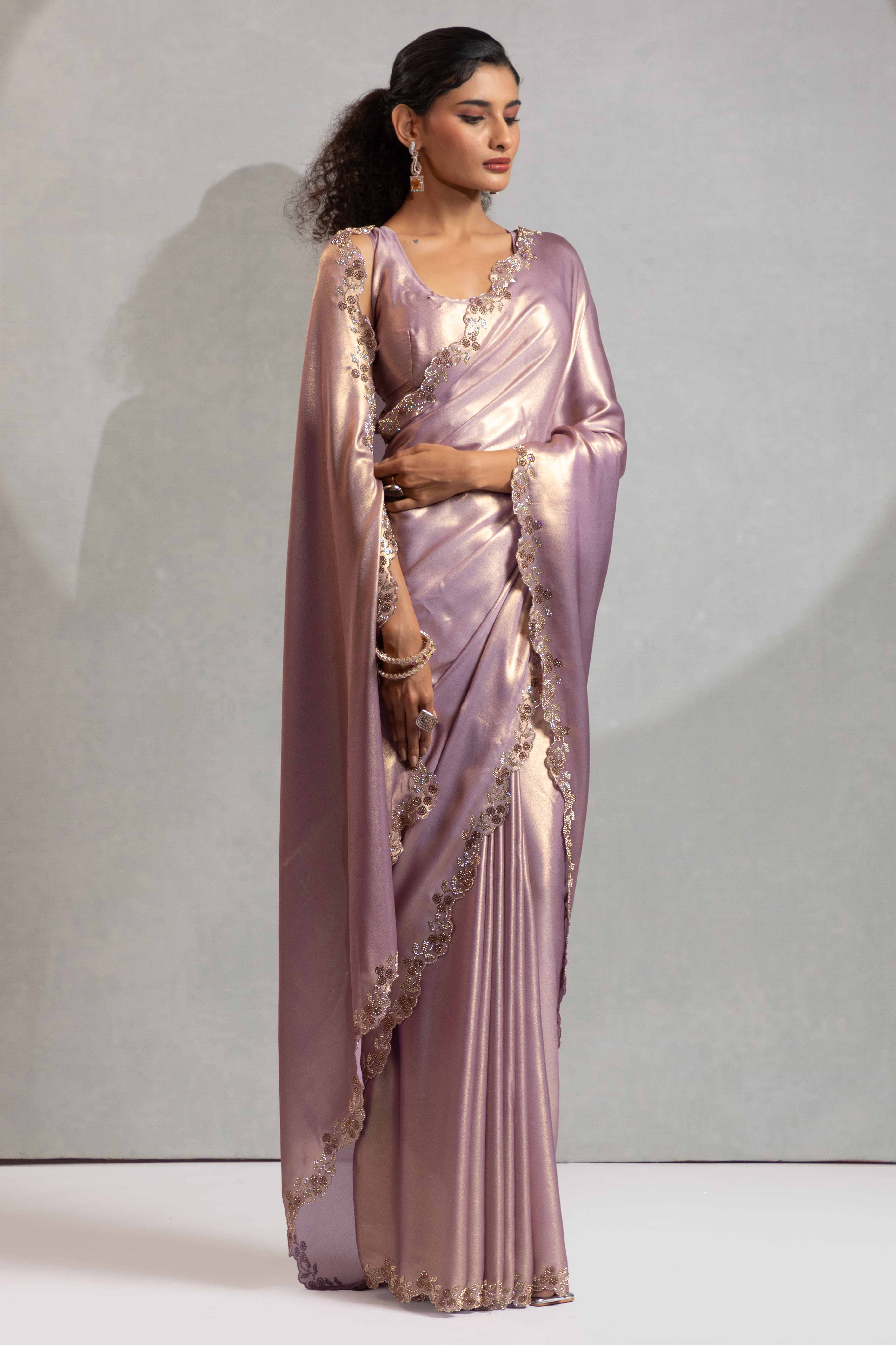 Lavender Satin Georgette Saree Adorned With Subtle Foil Finish & A Sparkling Zarkan Work Border