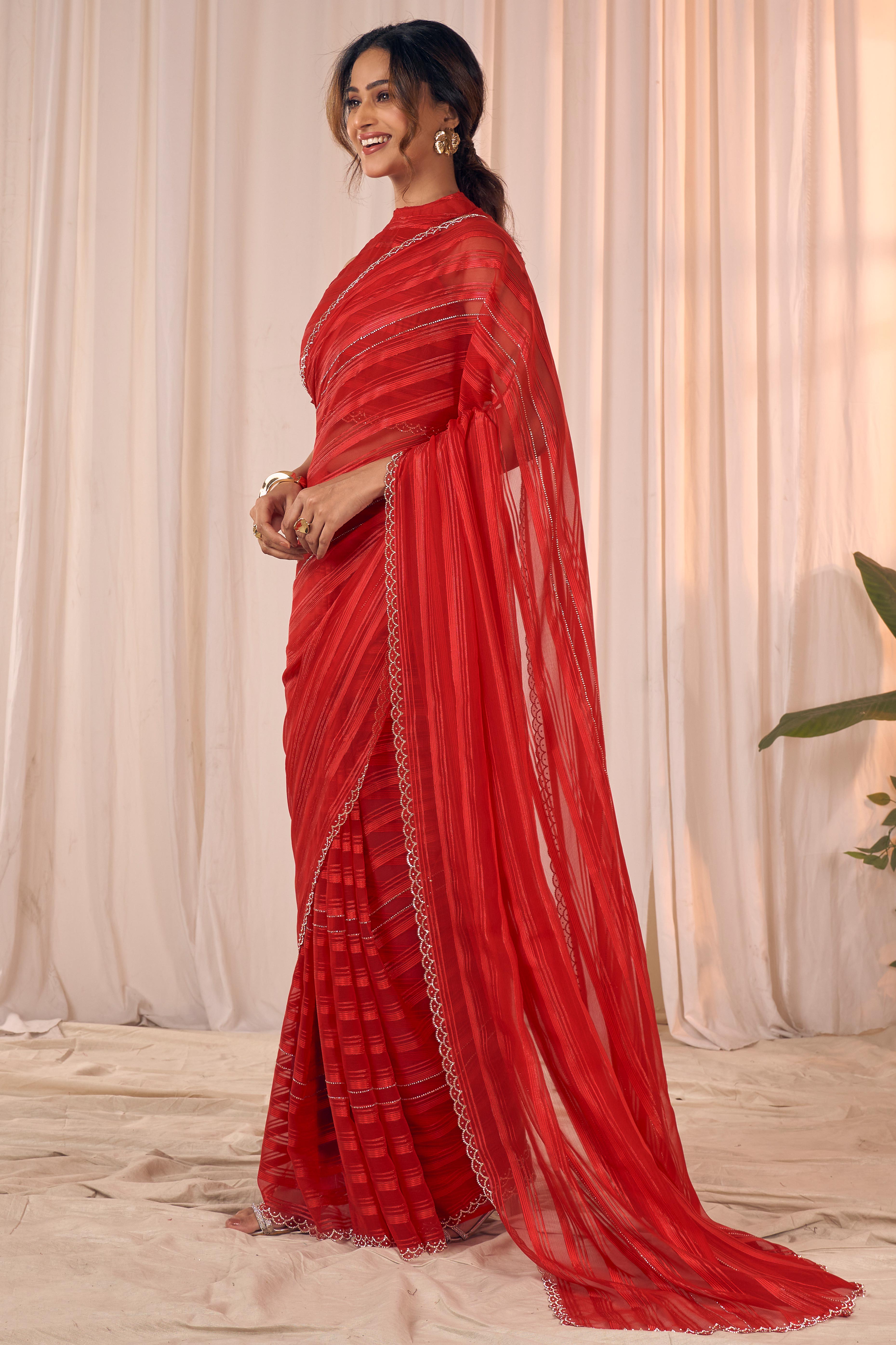 Red Striped Designer Georgette Saree Adorned With An Elegant Zarkan Cutwork Border