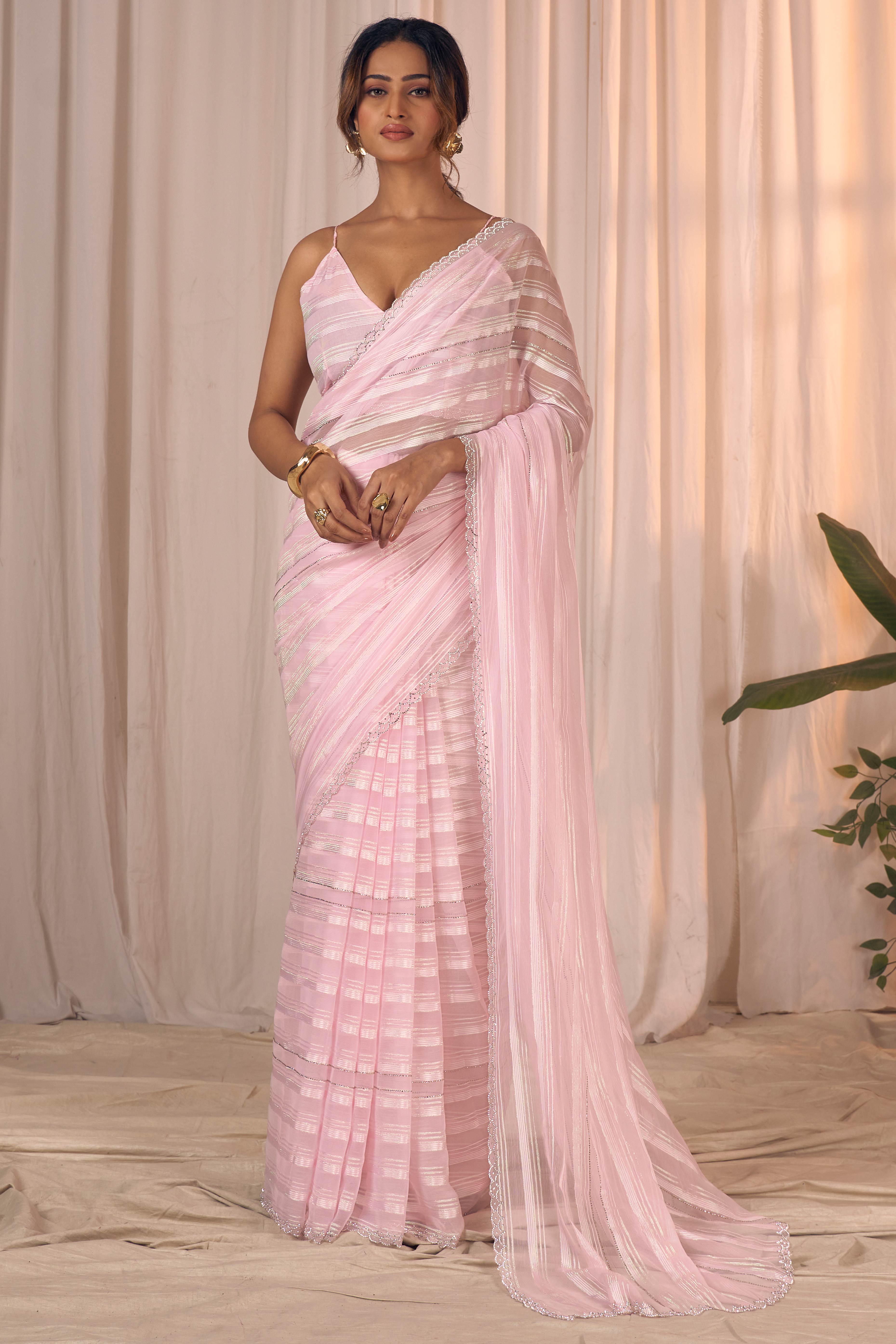 Orchid Pink Striped Georgette Saree With Sparkling Zarkan Work & An Elegant Cutwork Border