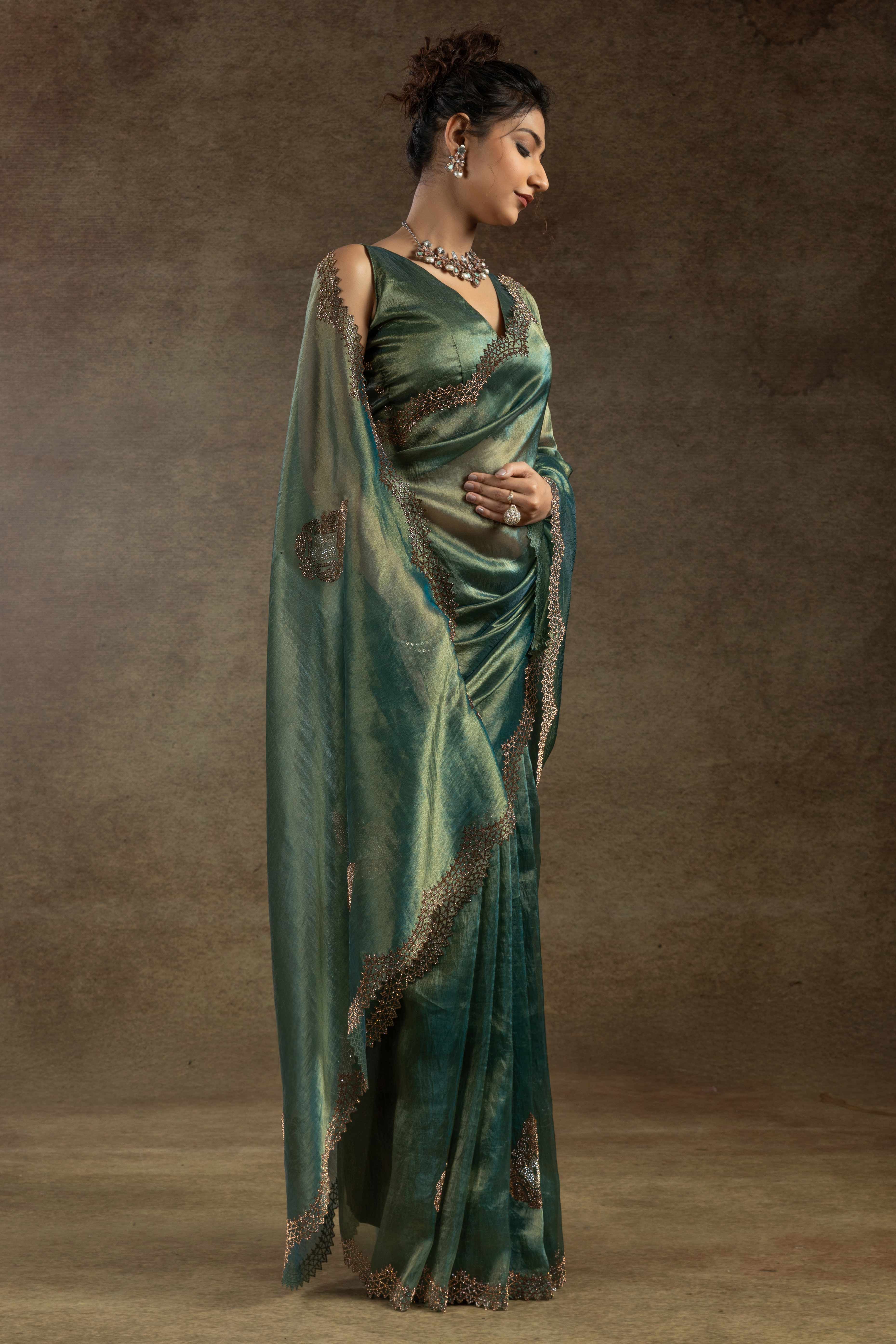 Green Banarasi Silk Saree with Stone Embellishments Perfect for Party Wear