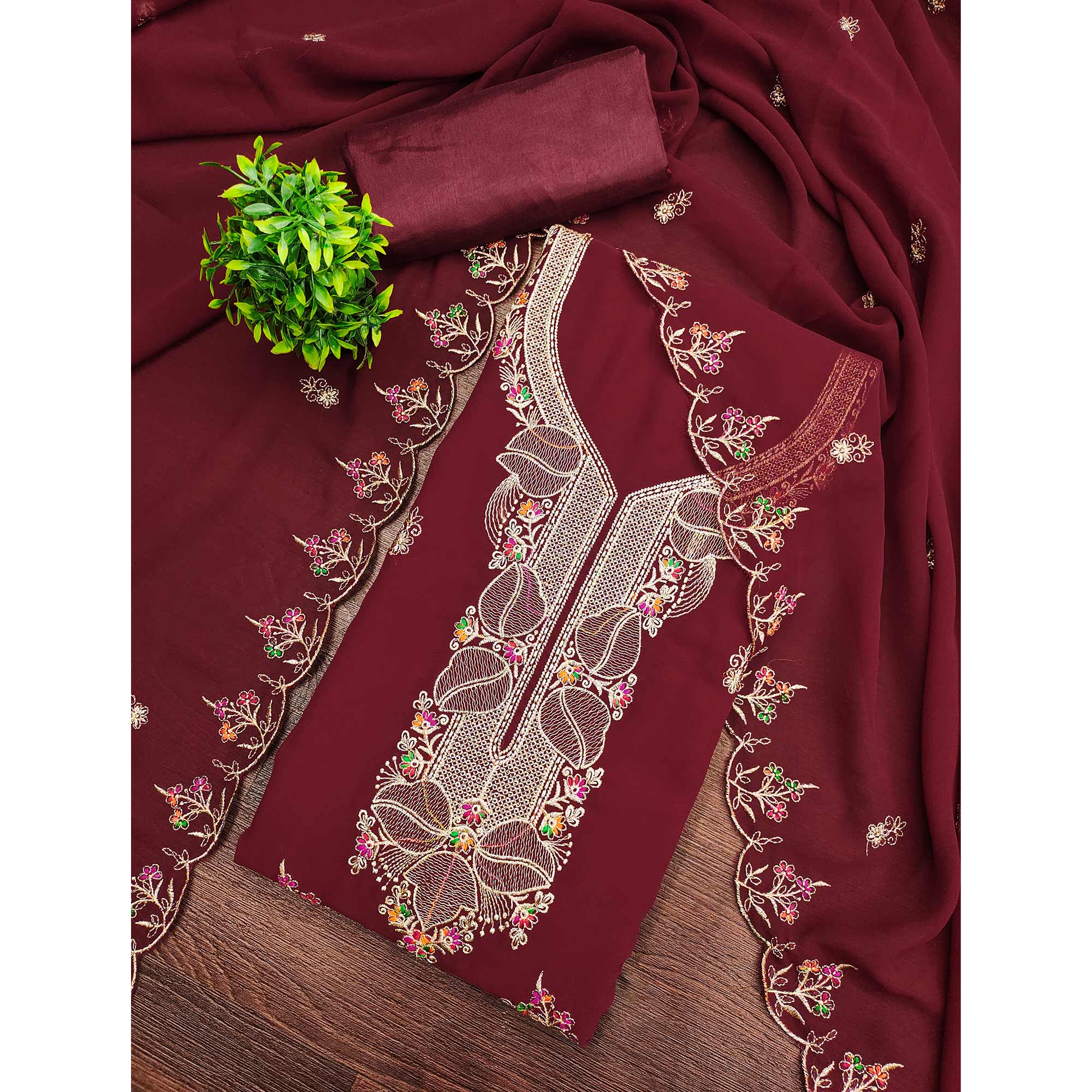 Maroon Georgette Dress Material Adorned With Floral Embroidery & Elegant Lace Border