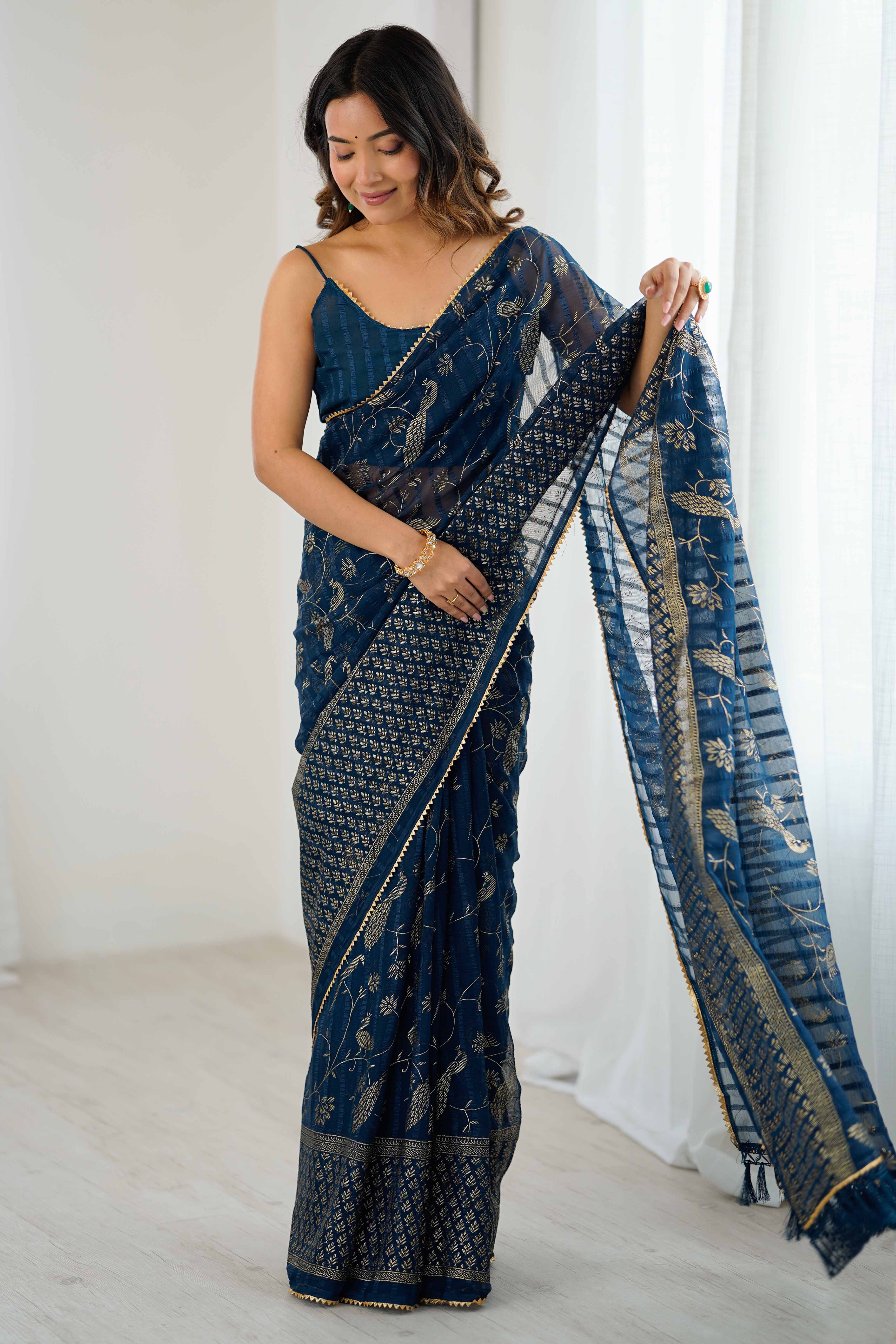 Morpich Blue Georgette Saree with Shimmering Foil Print & Gota Patti Border
