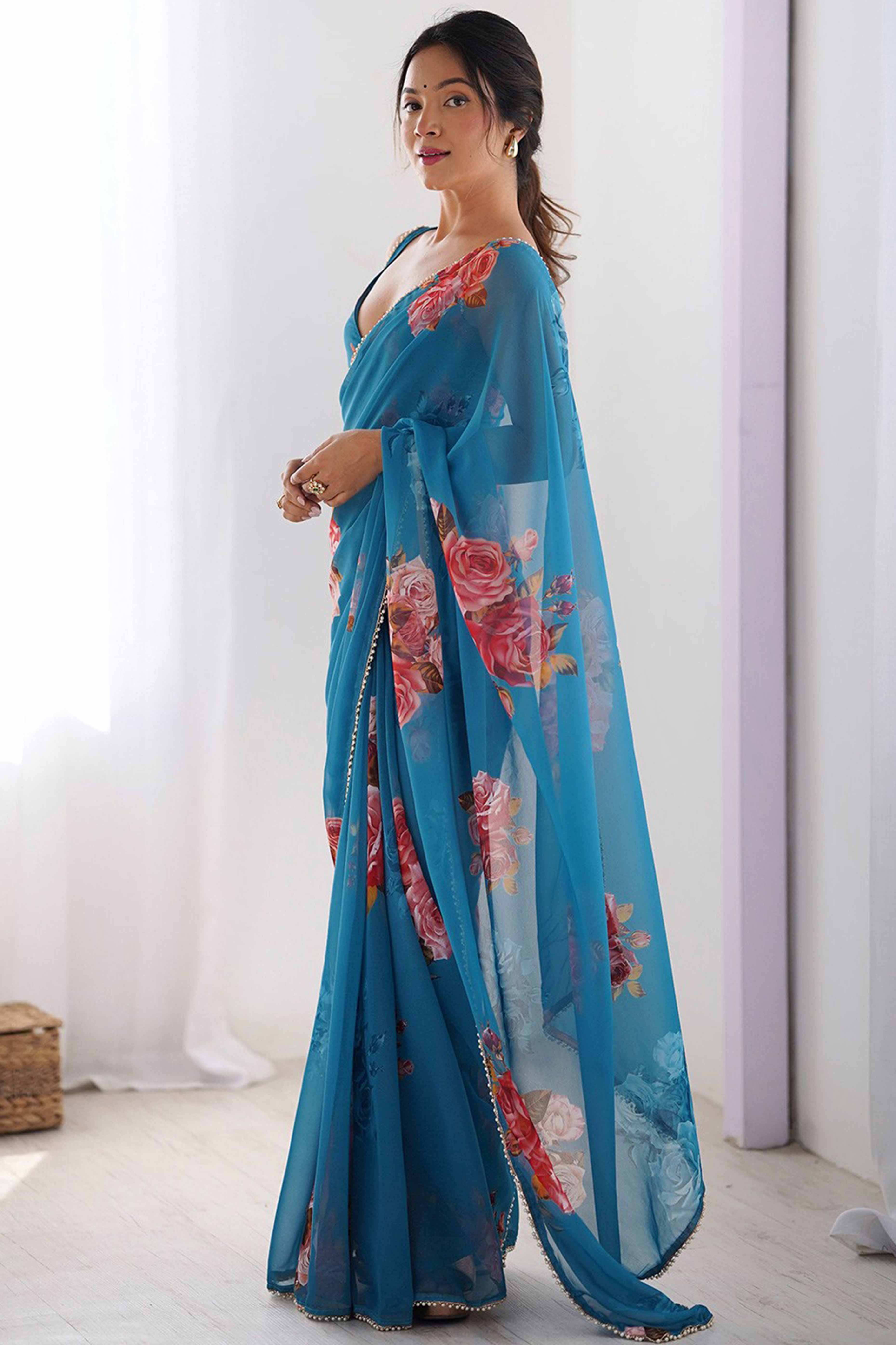 Partywear Teal Georgette Saree with Floral Prints and Bead Work Lace