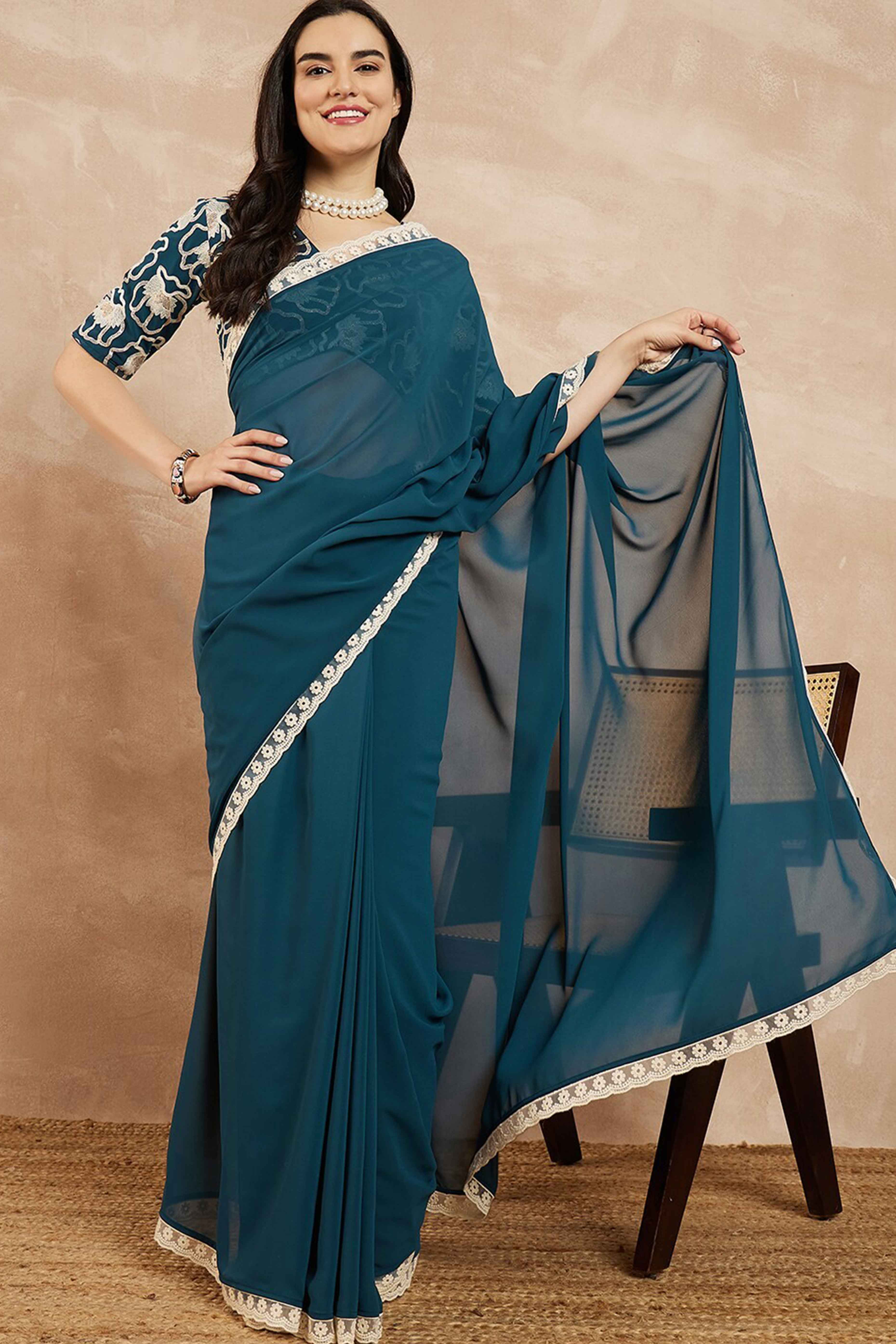 Teal Blue Solid Georgette Saree With Embroidered Border