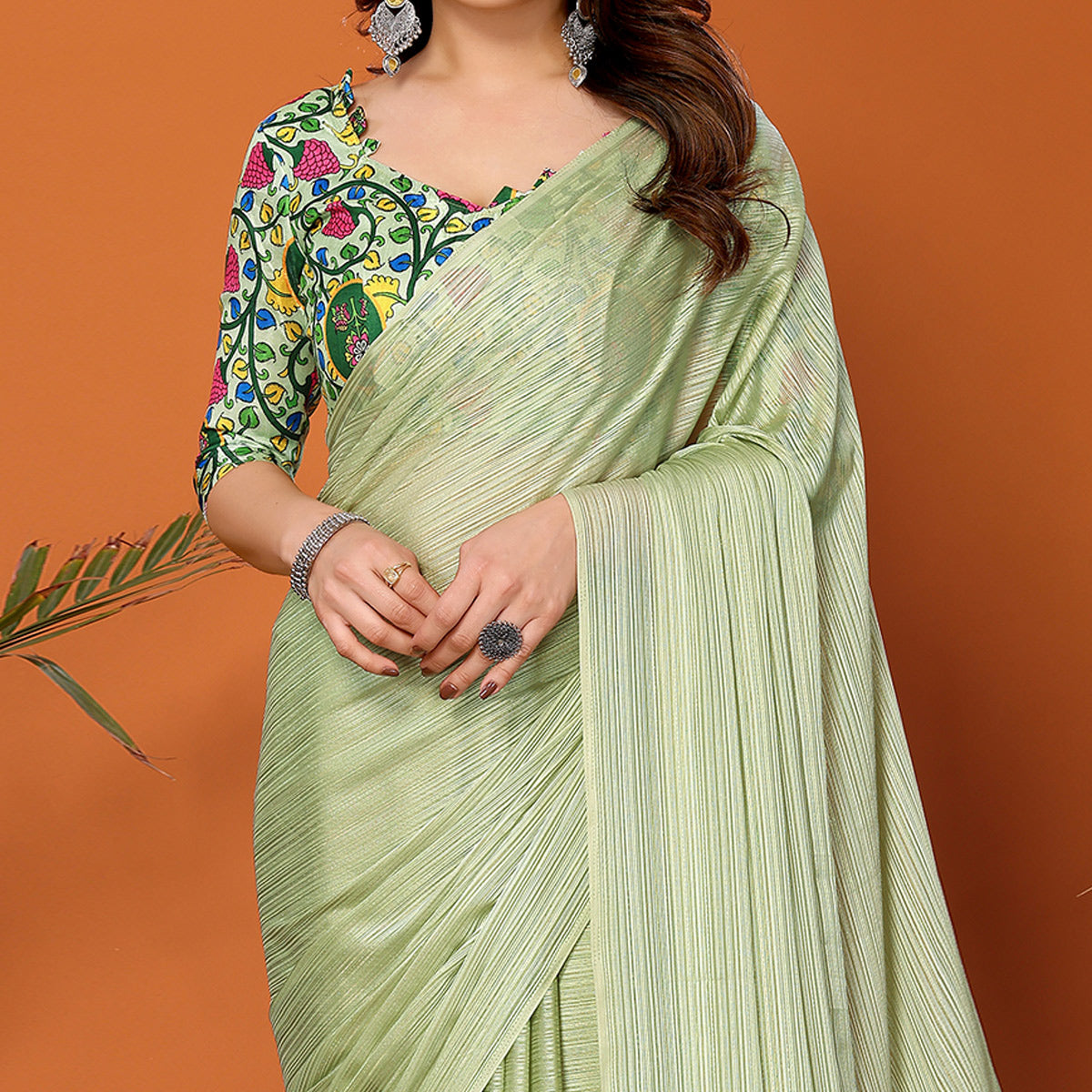 Pista Green Woven Satin Saree With Tassels