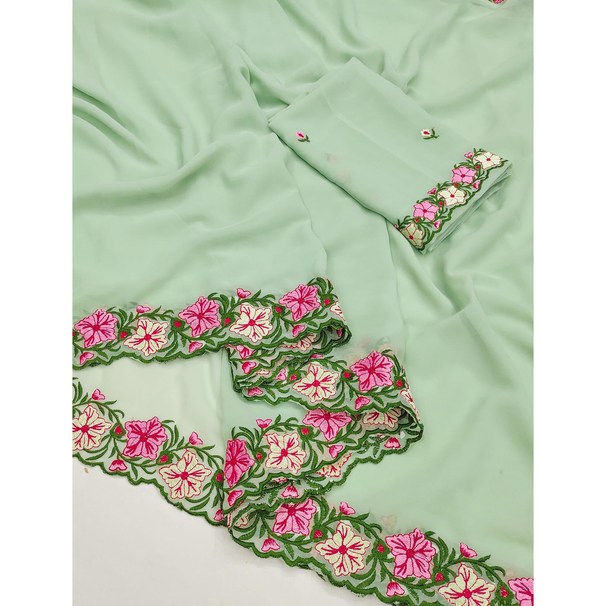 Green Faux Georgette Saree Featuring Minimalist Floral Border Embroidery