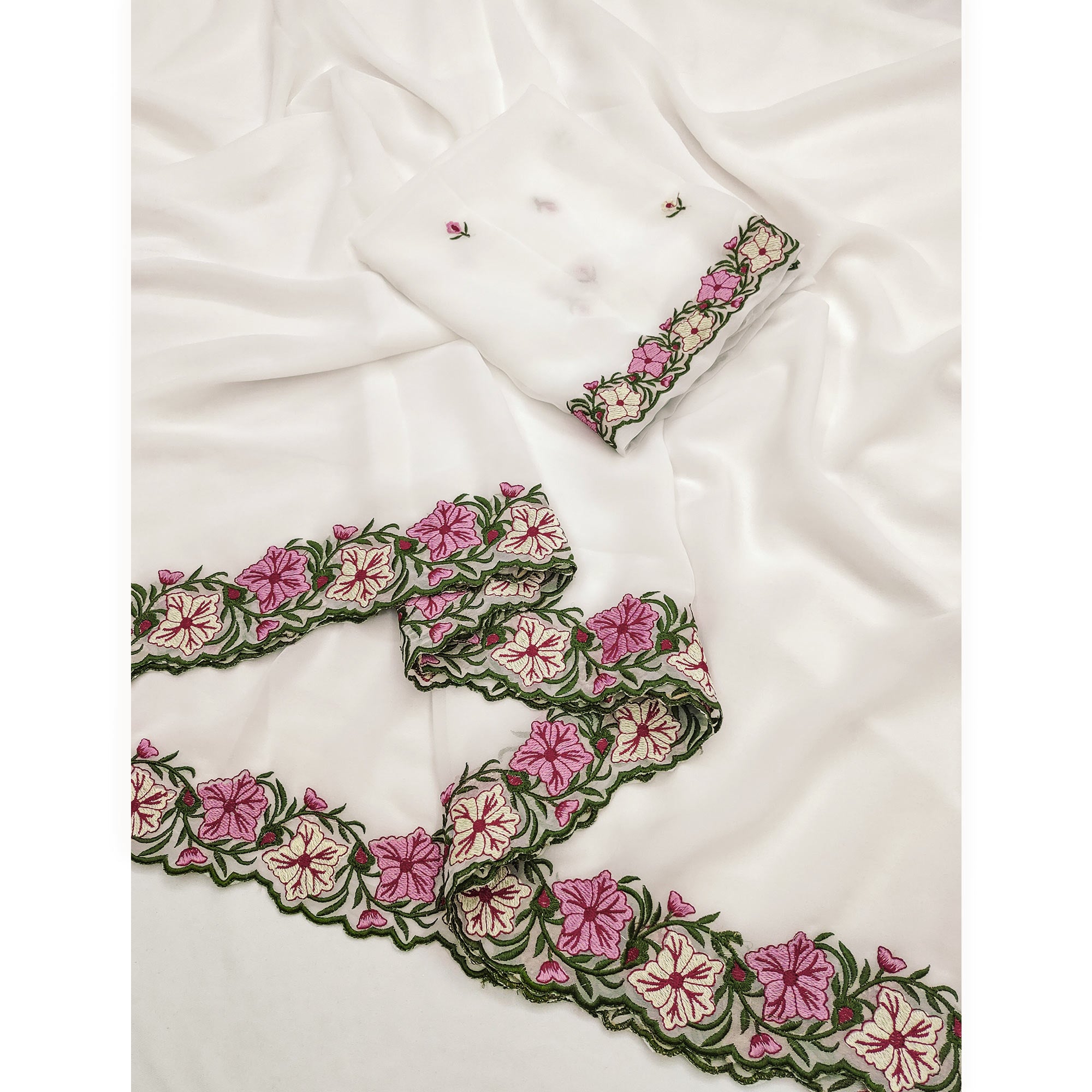 White Faux Georgette Saree Featuring Minimalist Floral Border Embroidery