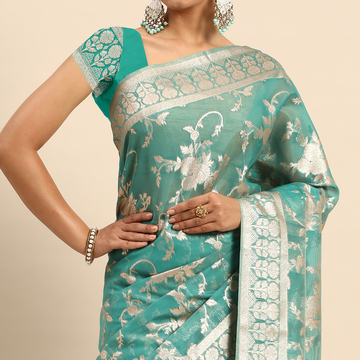 Turquoise Floral Woven Organza Silk Saree With Tassels