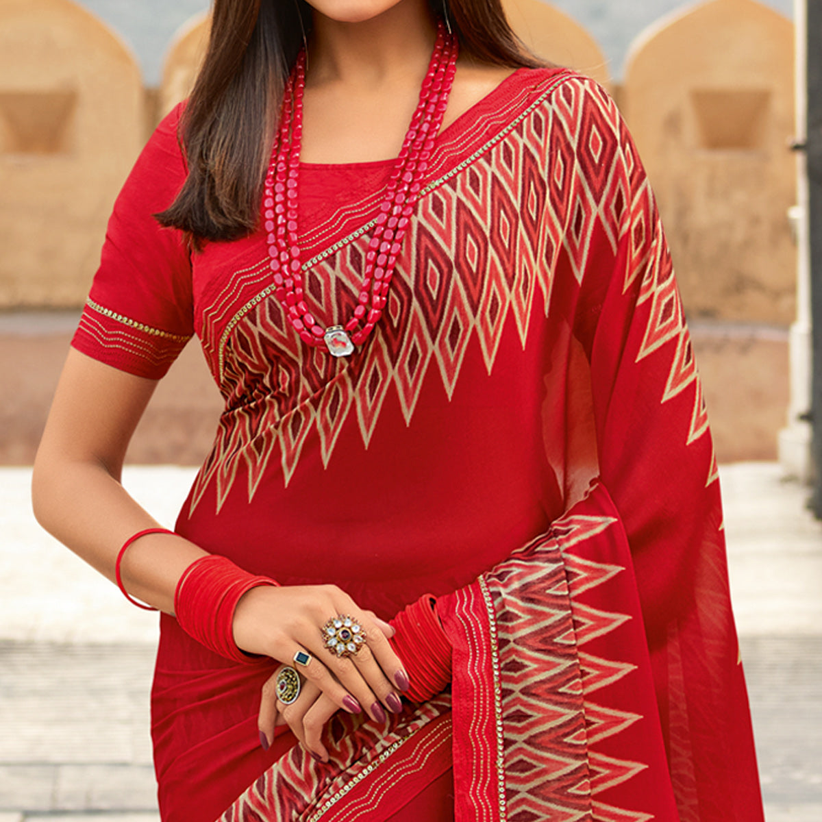 Red Printed With Embroidered Border Georgette Saree