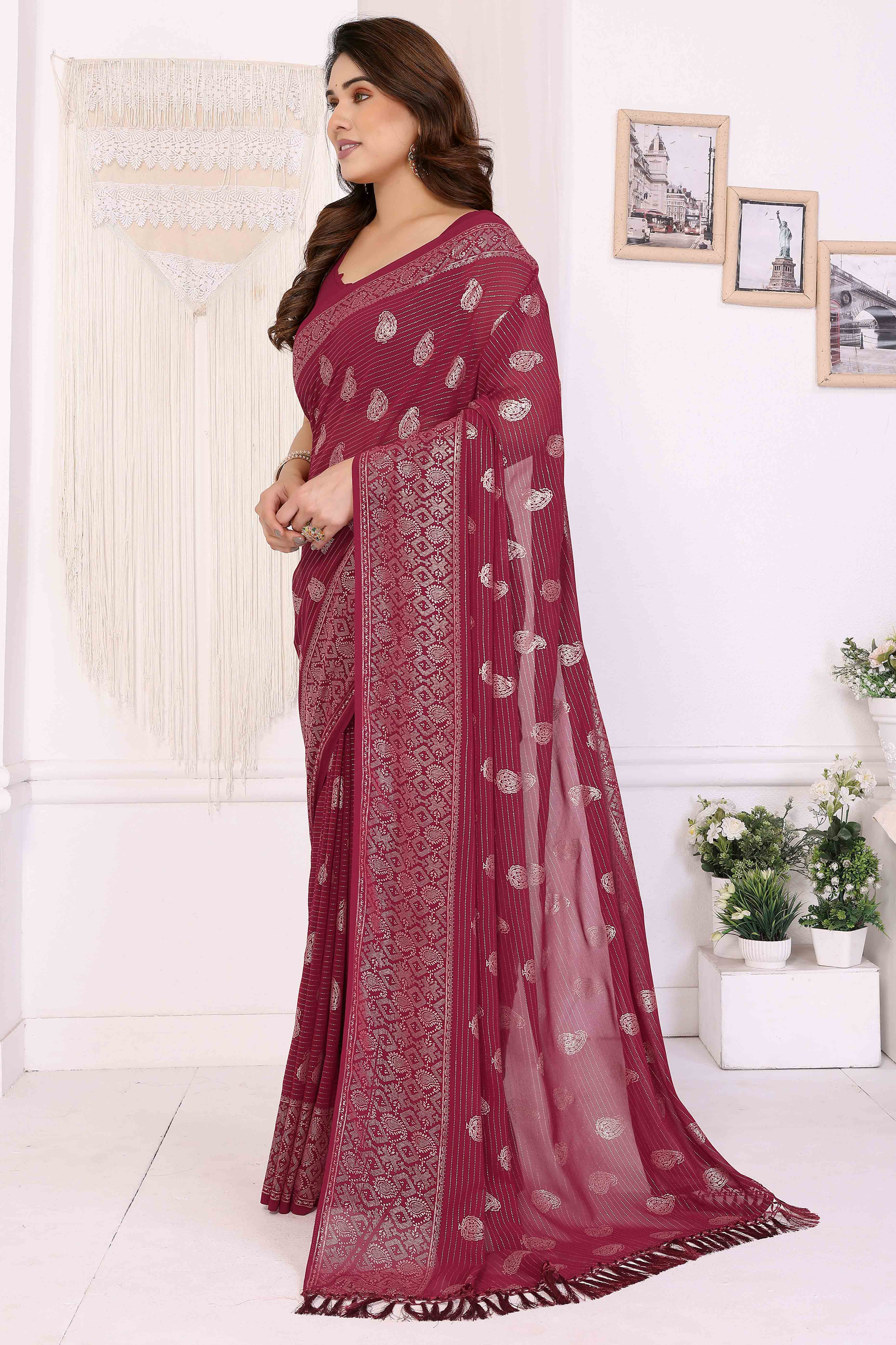 Maroon Foil Printed Georgette Saree Enhanced With Delicate Lace Border & Elegant Tassel