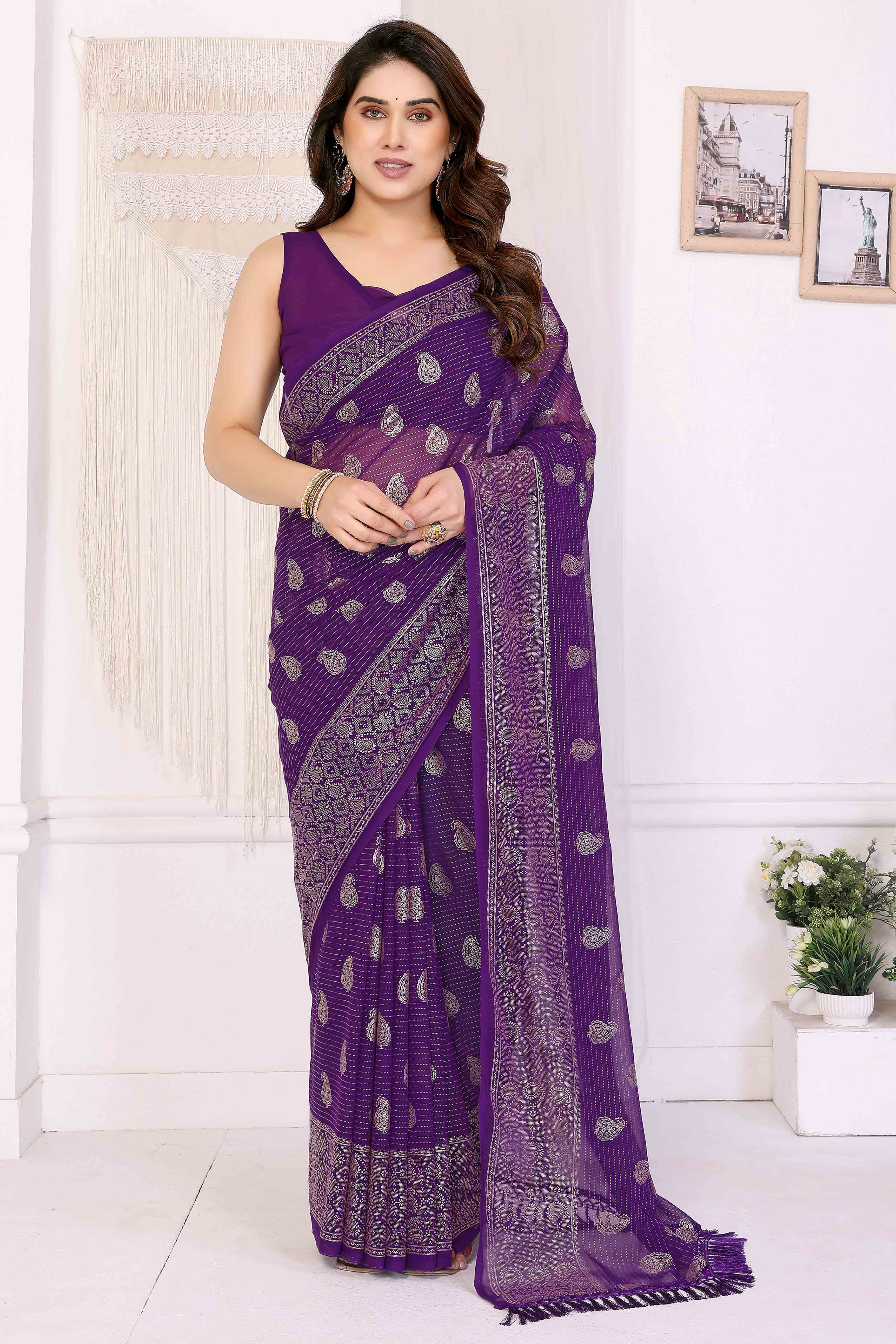 Purple Foil Printed Georgette Saree Enhanced With Delicate Lace Border & Elegant Tassel