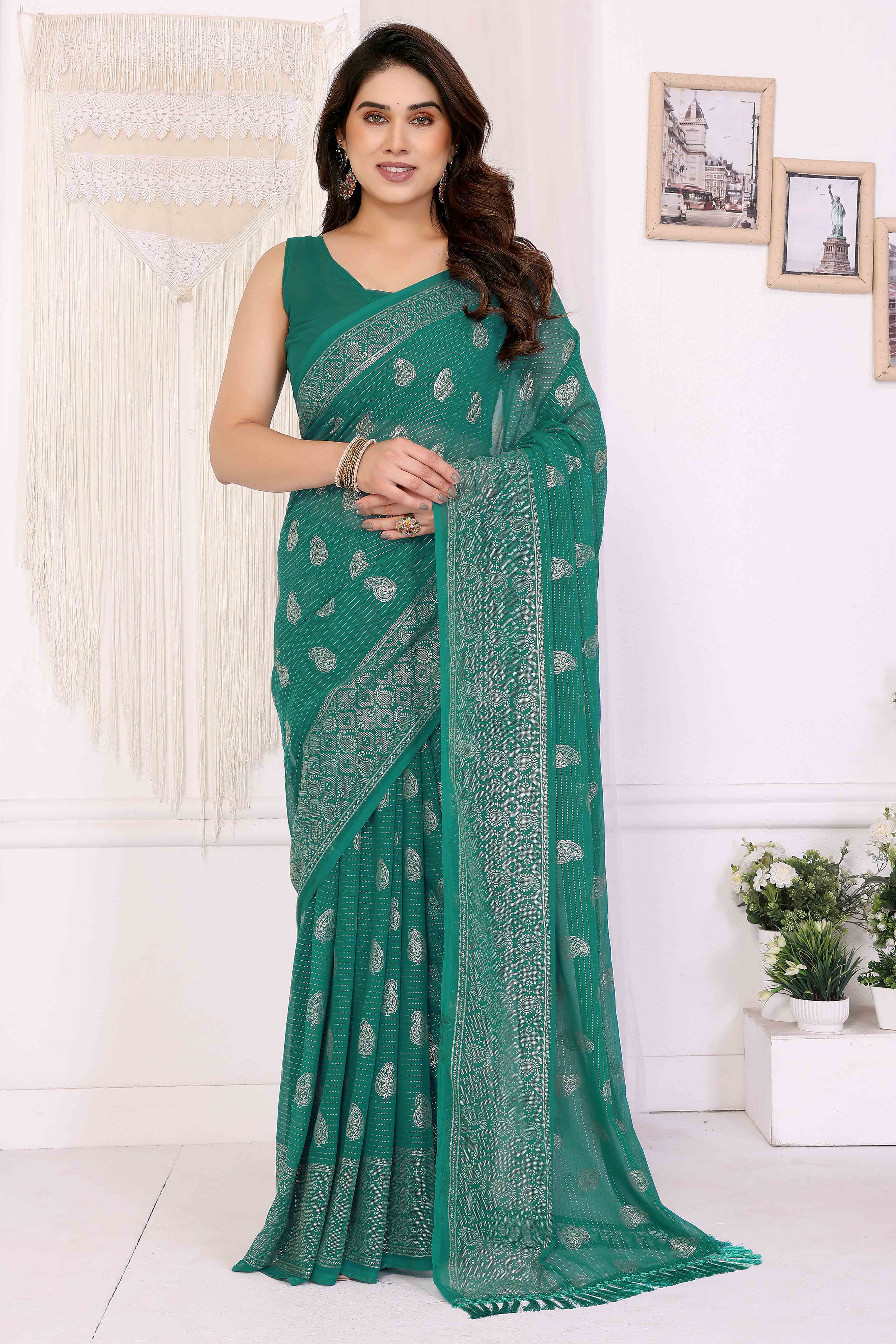 Rama Green Foil Printed Georgette Saree Enhanced With Delicate Lace Border & Elegant Tassel