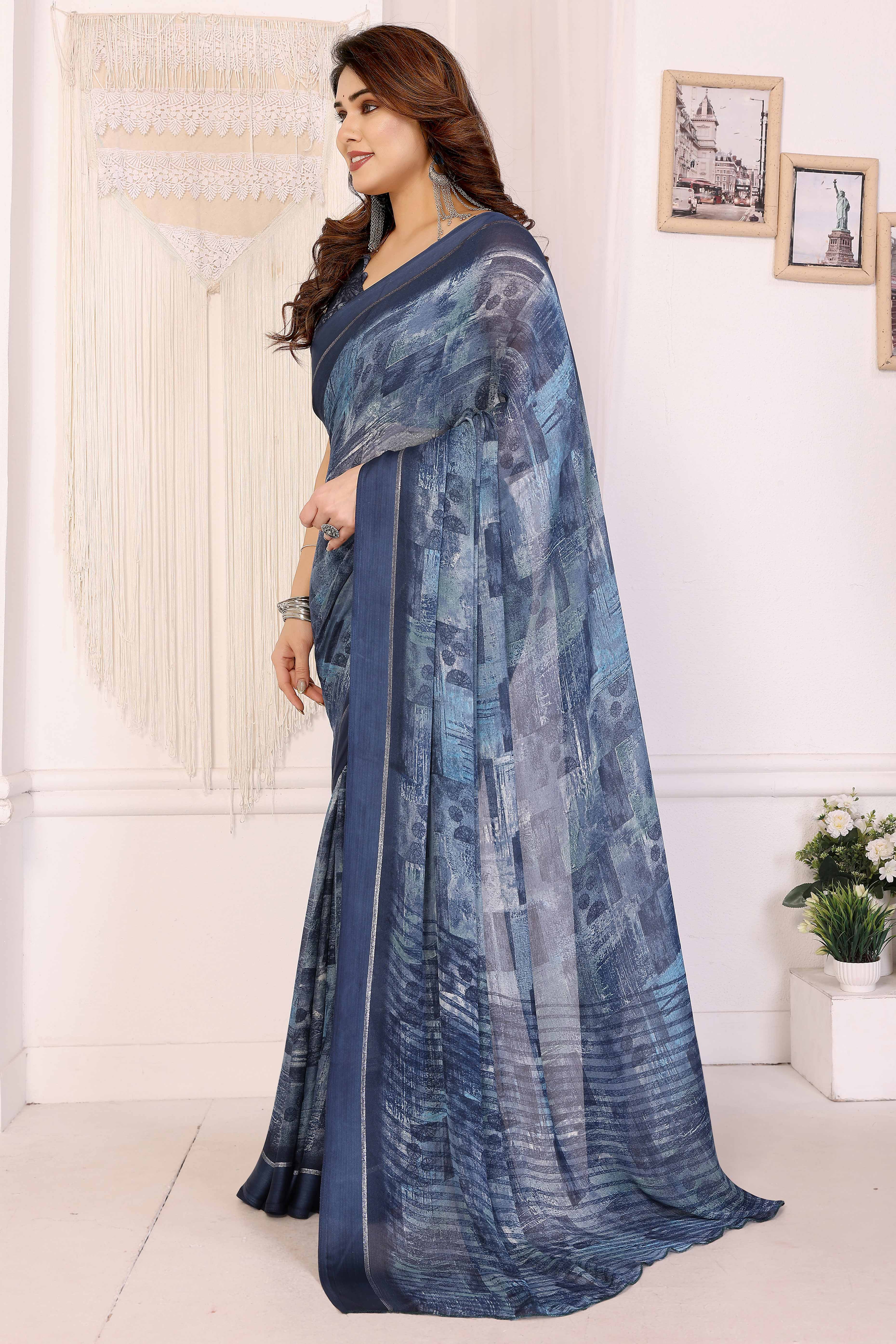 Trendy Blue Moss Crepe Saree with Floral Motifs and Satin Border
