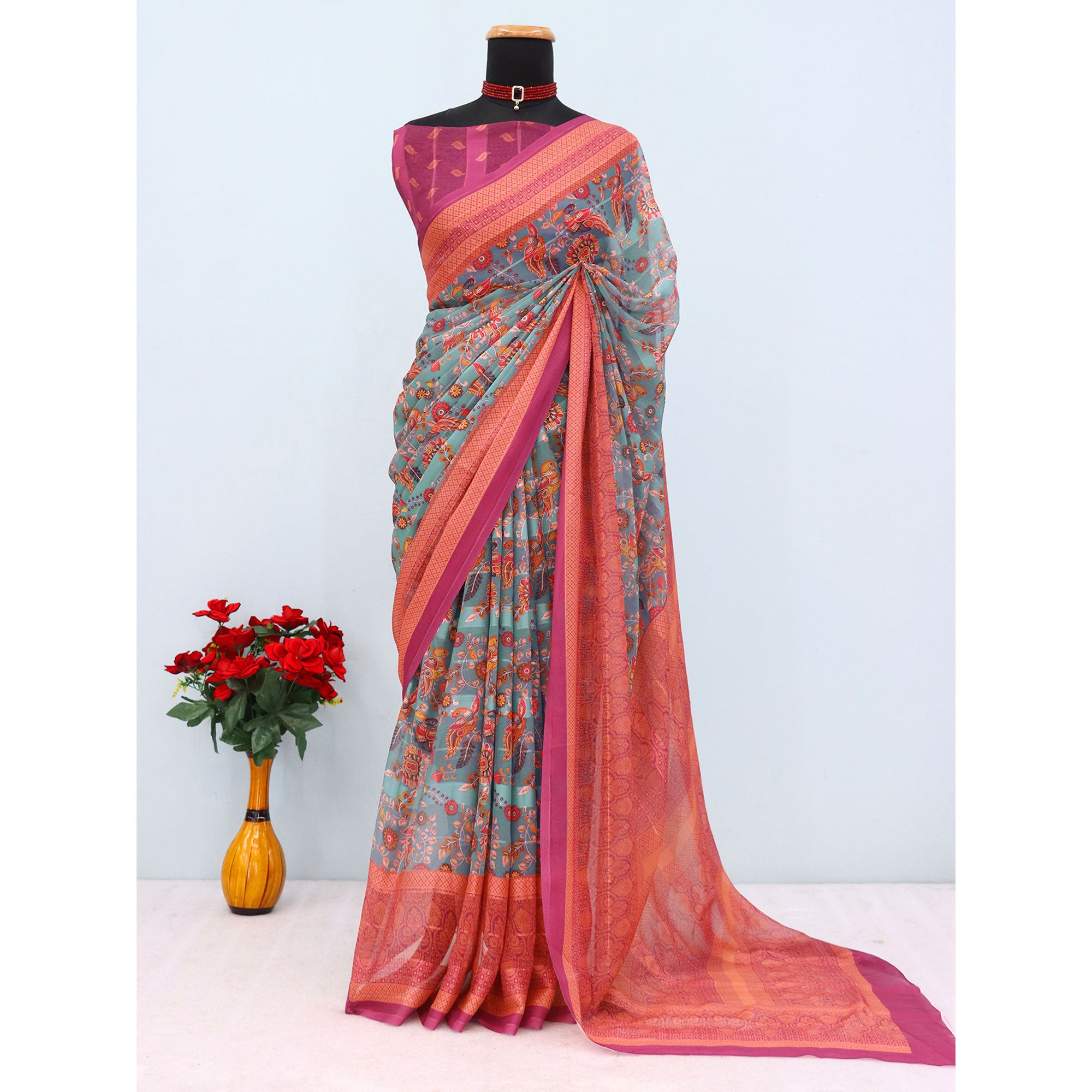 Elegant Rama Blue & Magenta Floral Digital Printed Georgette Saree Adorned With Subtle Zari Stripes