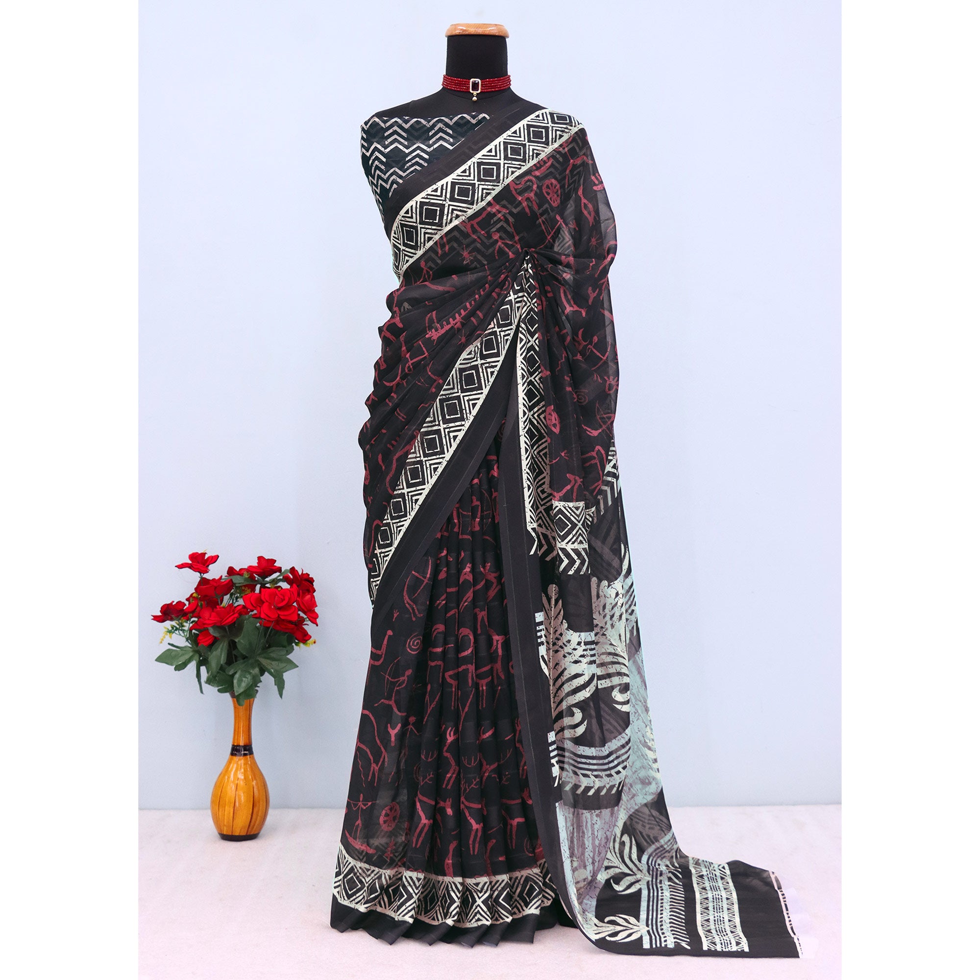 Charming Black Digital Printed Georgette Saree Accentuated With Zari Stripes
