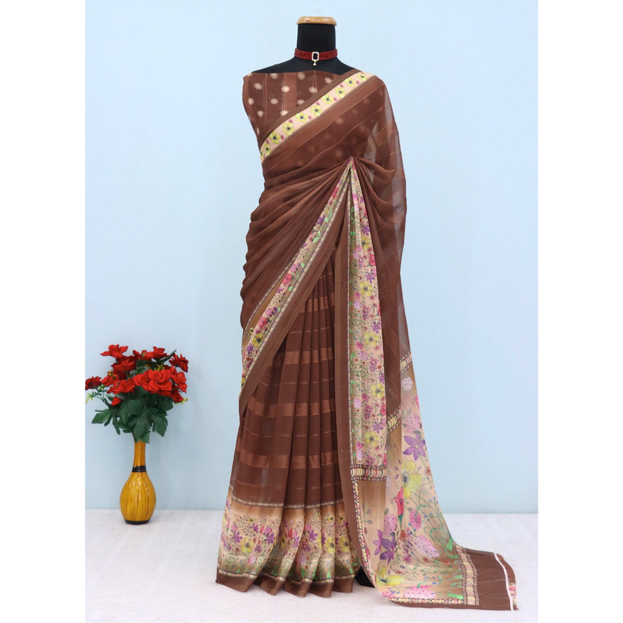 Charming Brown Floral Digital Printed Georgette Saree Accentuated With Zari Stripes