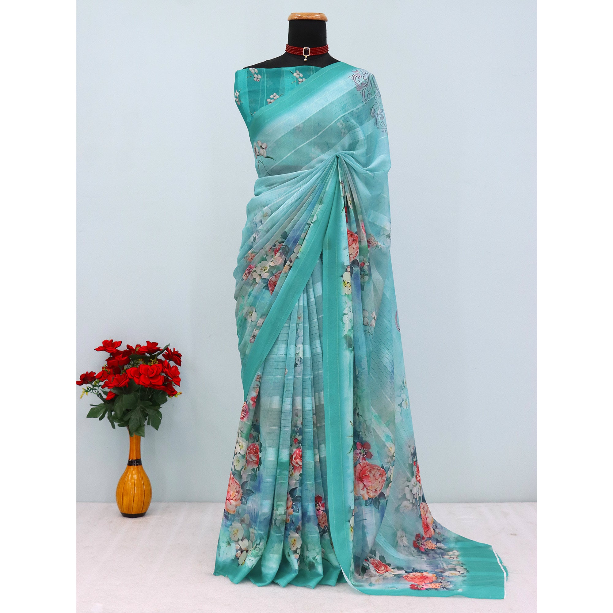 Charming Turquoise Blue Floral Digital Printed Georgette Saree Accentuated With Zari Stripes