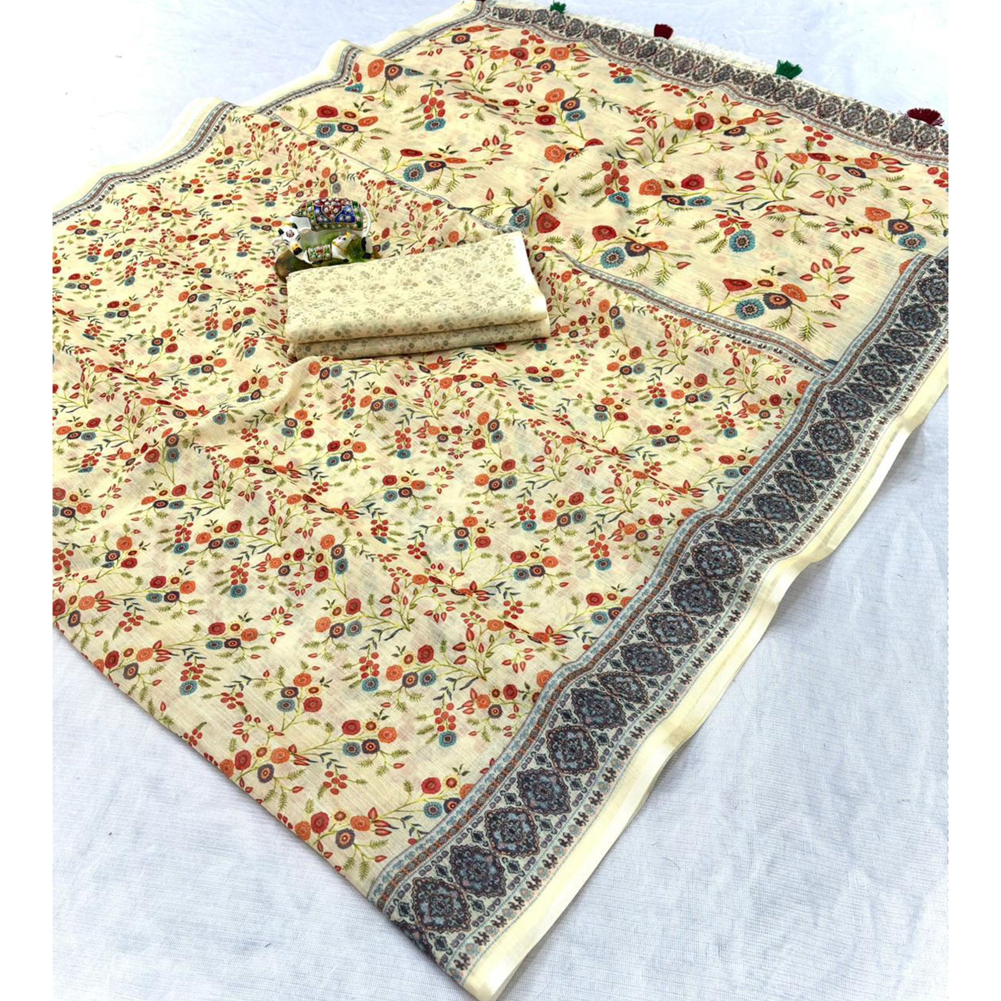 Luxurious Cream Floral Printed Linen Cotton Saree with Decorative Fancy Latkan Pallu