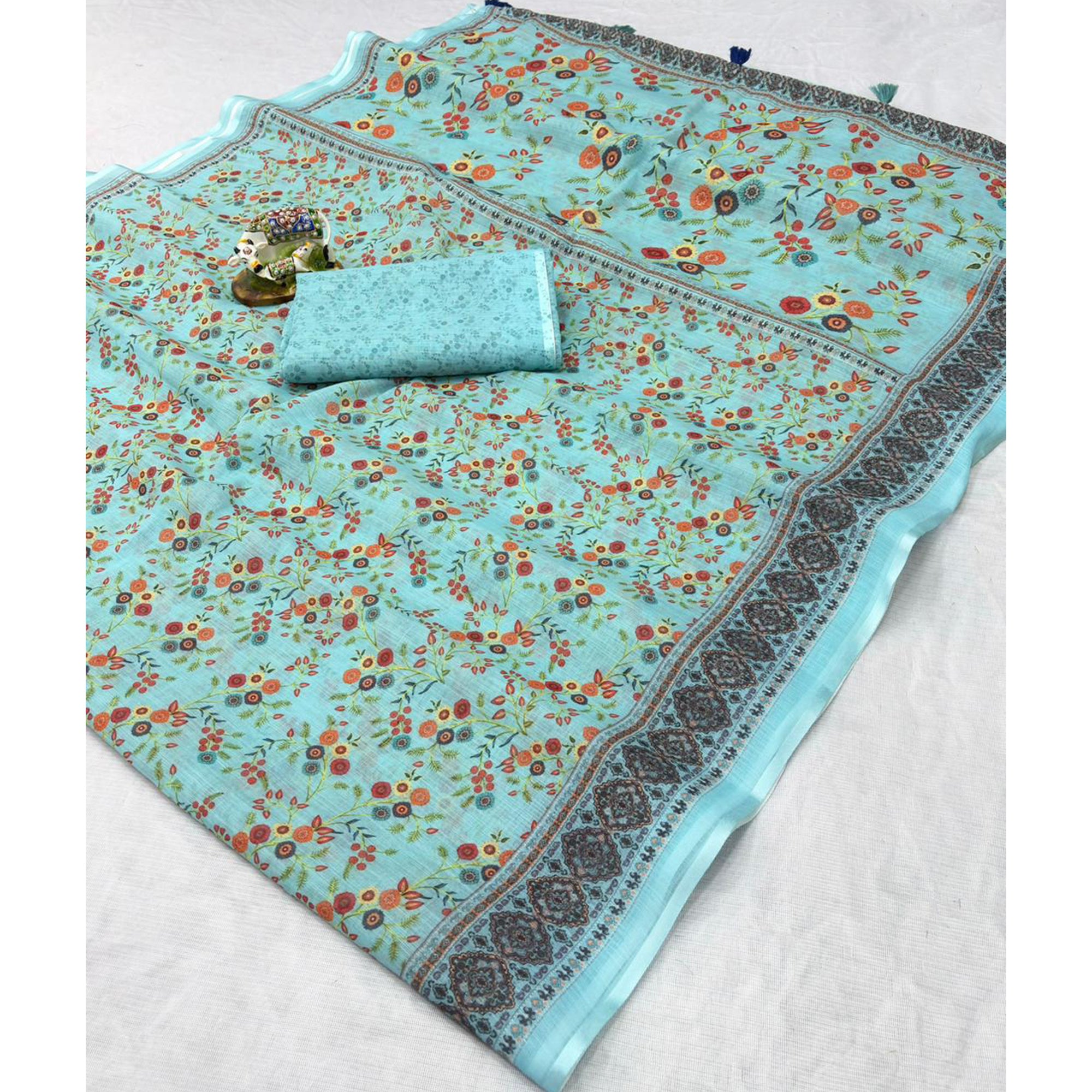 Luxurious Pale Turquoise Floral Printed Linen Cotton Saree with Decorative Fancy Latkan Pallu