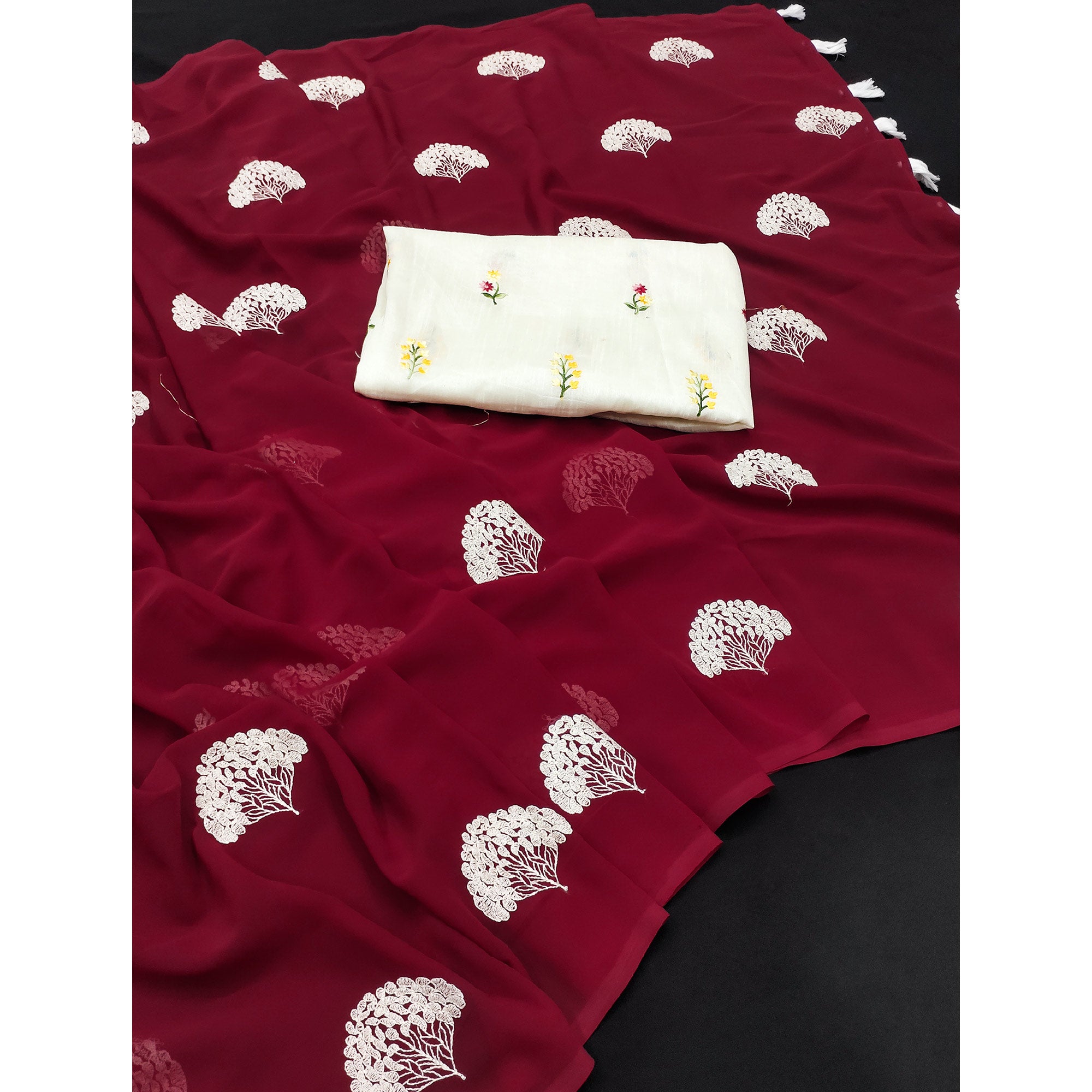 Maroon Thread Embroidered Georgette Saree With Tassels