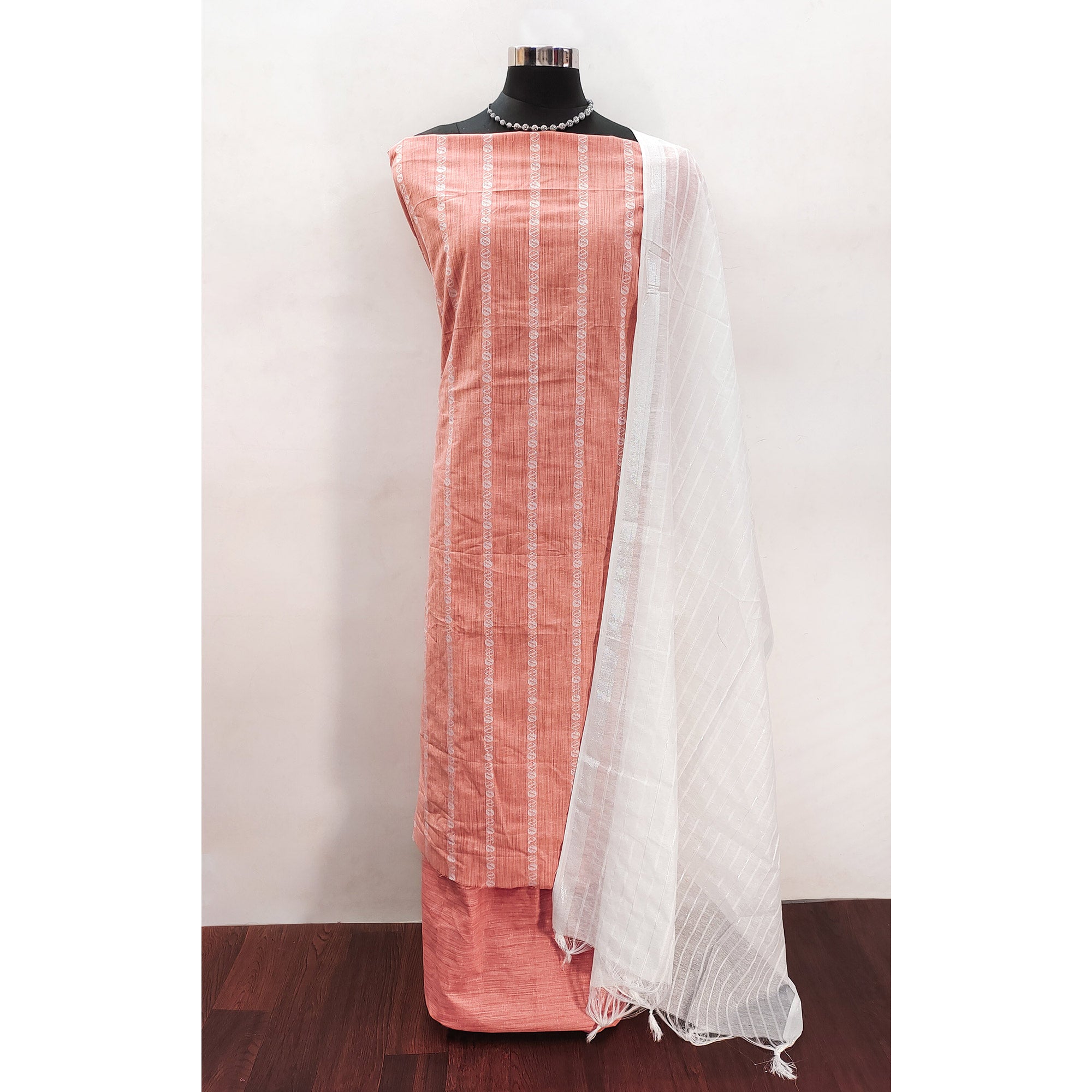 Intricate Weaving Work on Peach Pure Cotton Dress Material